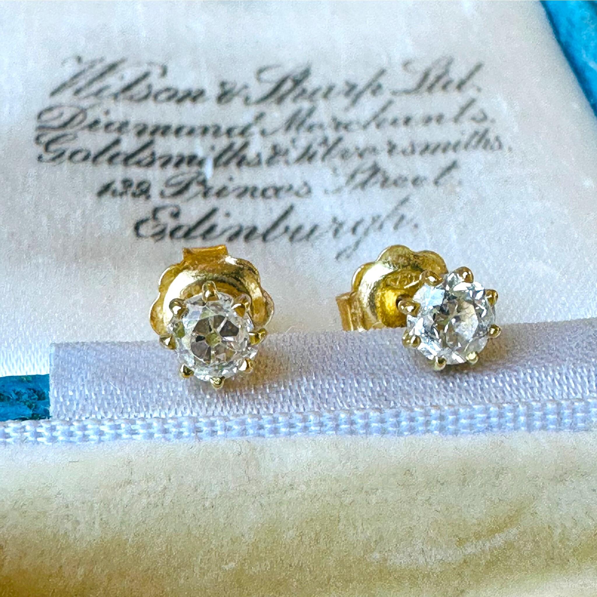 Old European Cut Diamond Earrings: 18k Gold Solitaire Studs (0.80ct) displayed on antique box