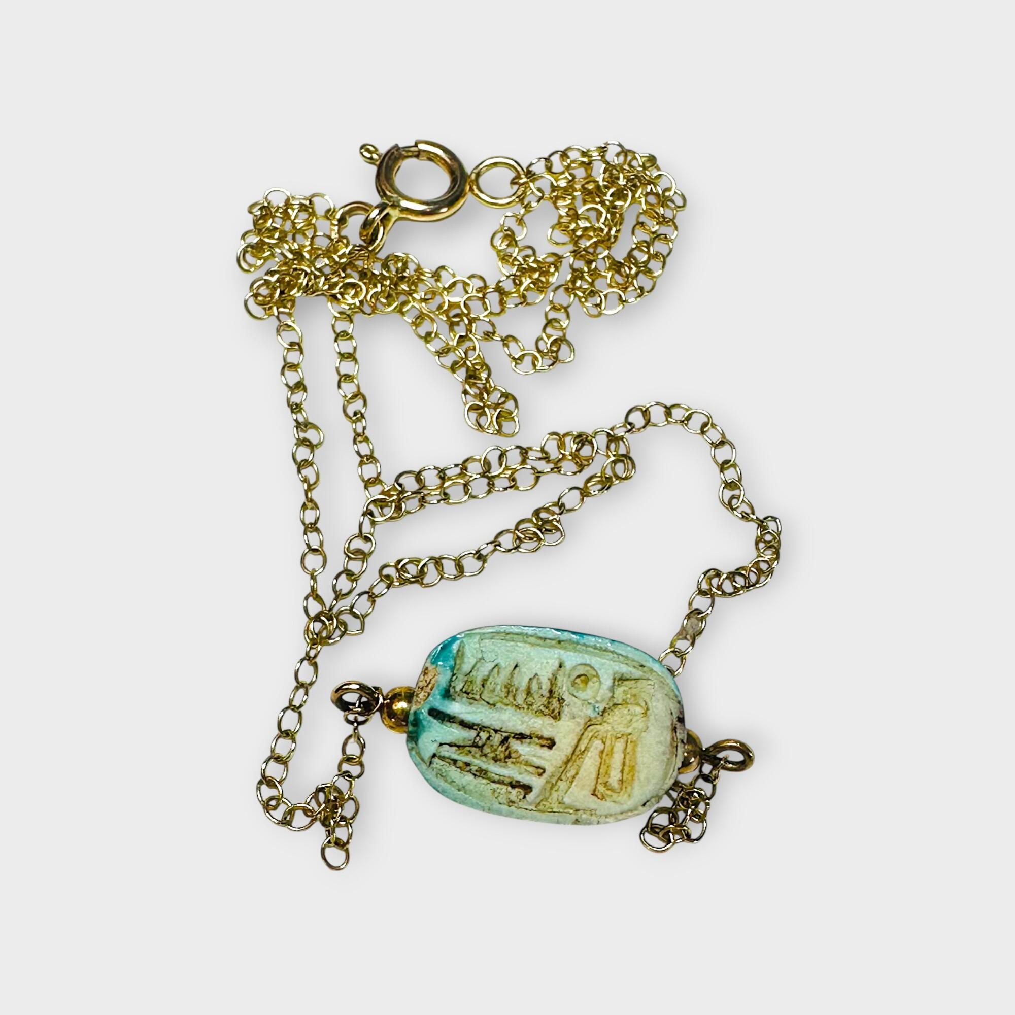 rear view,9k Gold Blue Faience Scarab Necklace – Egyptian Revival Pendant, grey background.