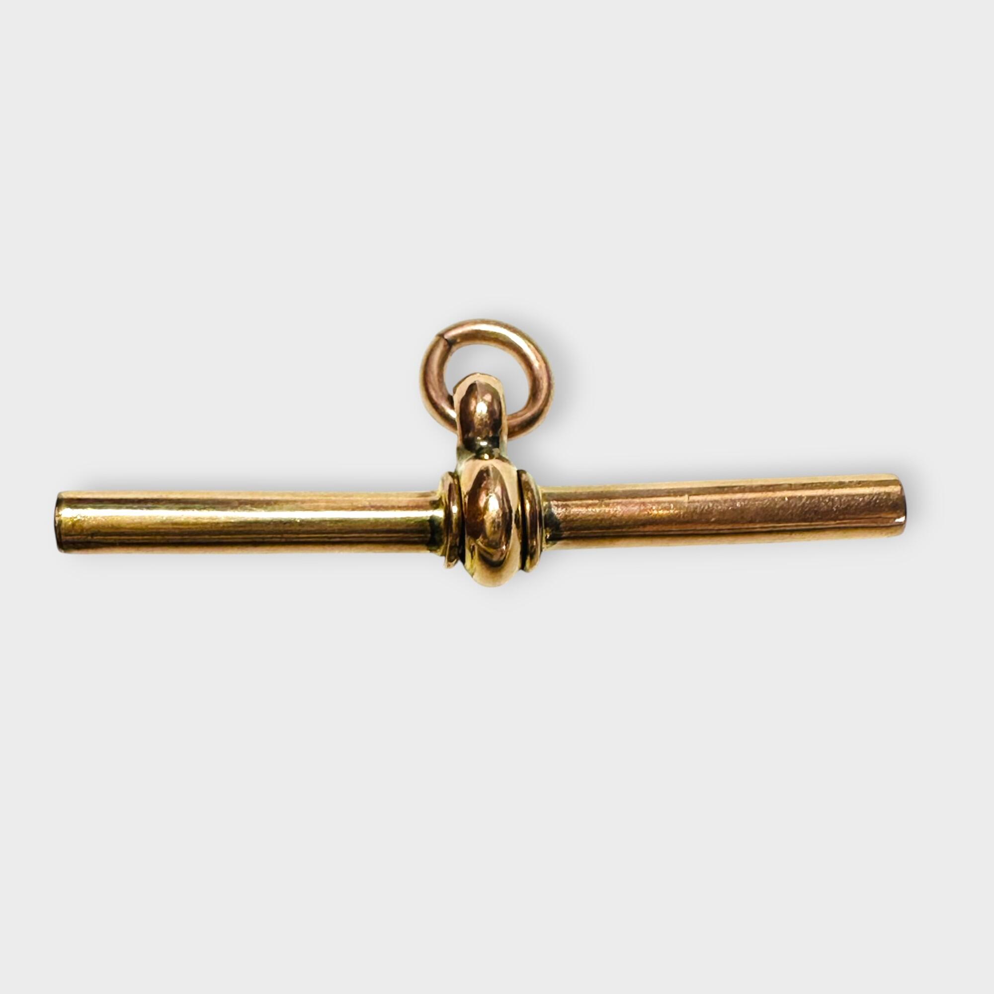 Edwardian 9k Rose Gold T-Bar Fitting, grey background.