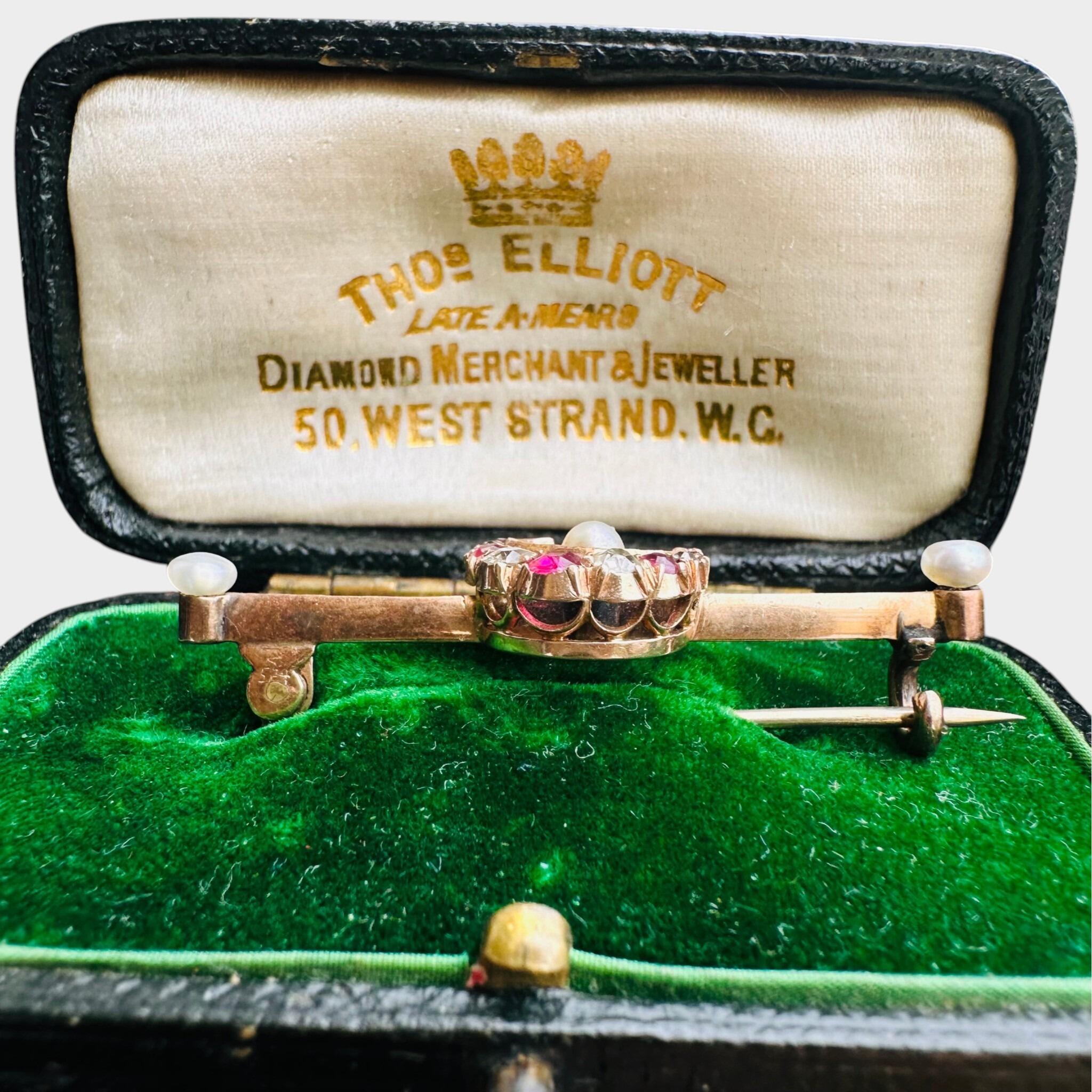 15ct Gold Diamond, Ruby & Pearl Crescent Moon Brooch displayed in green velvet antique box