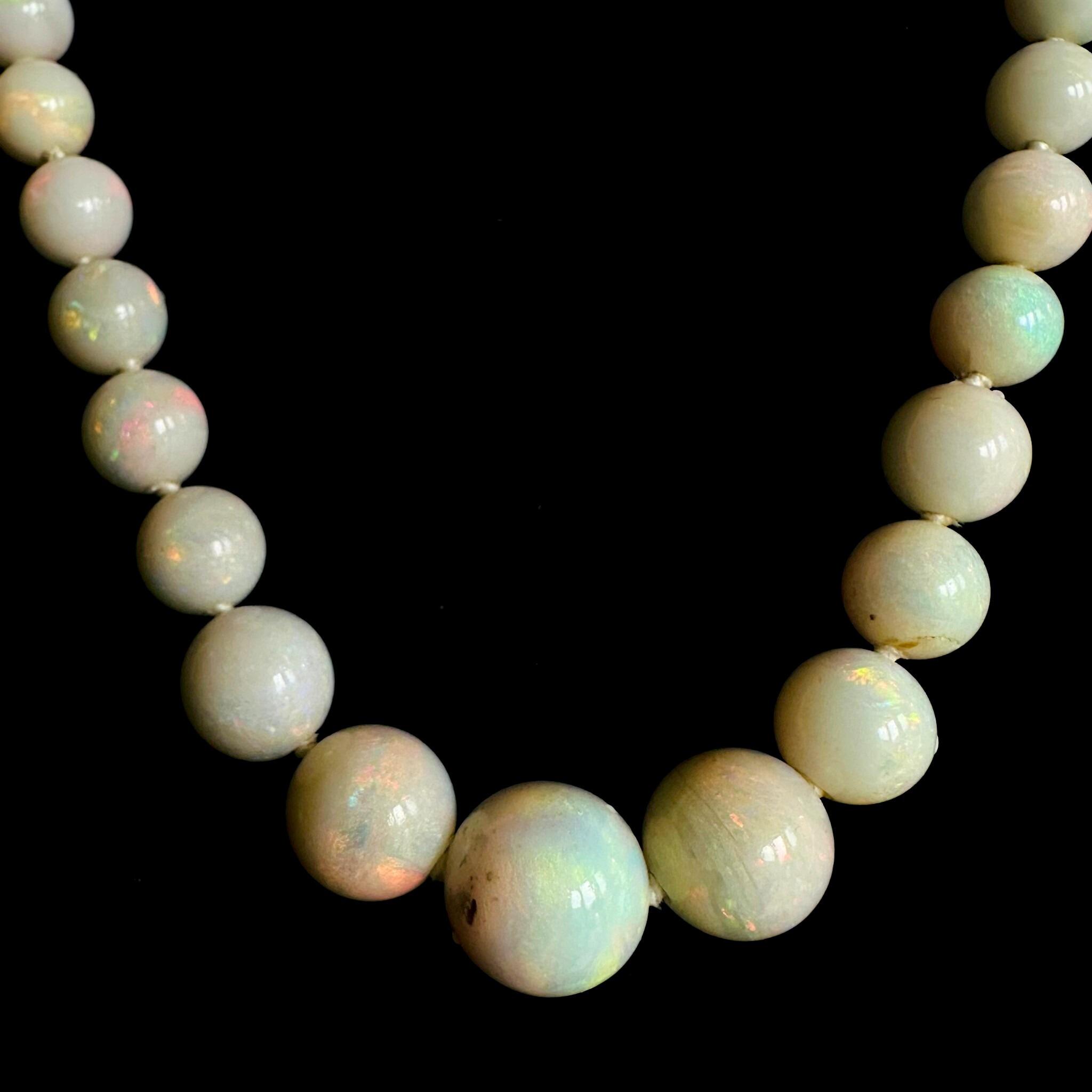 close up of Art Deco Graduated Opal Bead & Gold Bike Chain Necklace displayed on black velvet