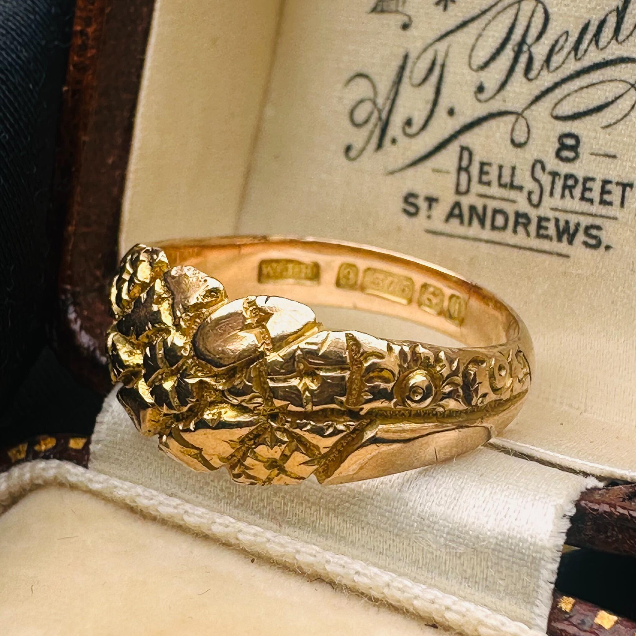 side profile of Antique Art Nouveau Gold English Repoussé Ivy & Rose Dress Ring displayed on antique box