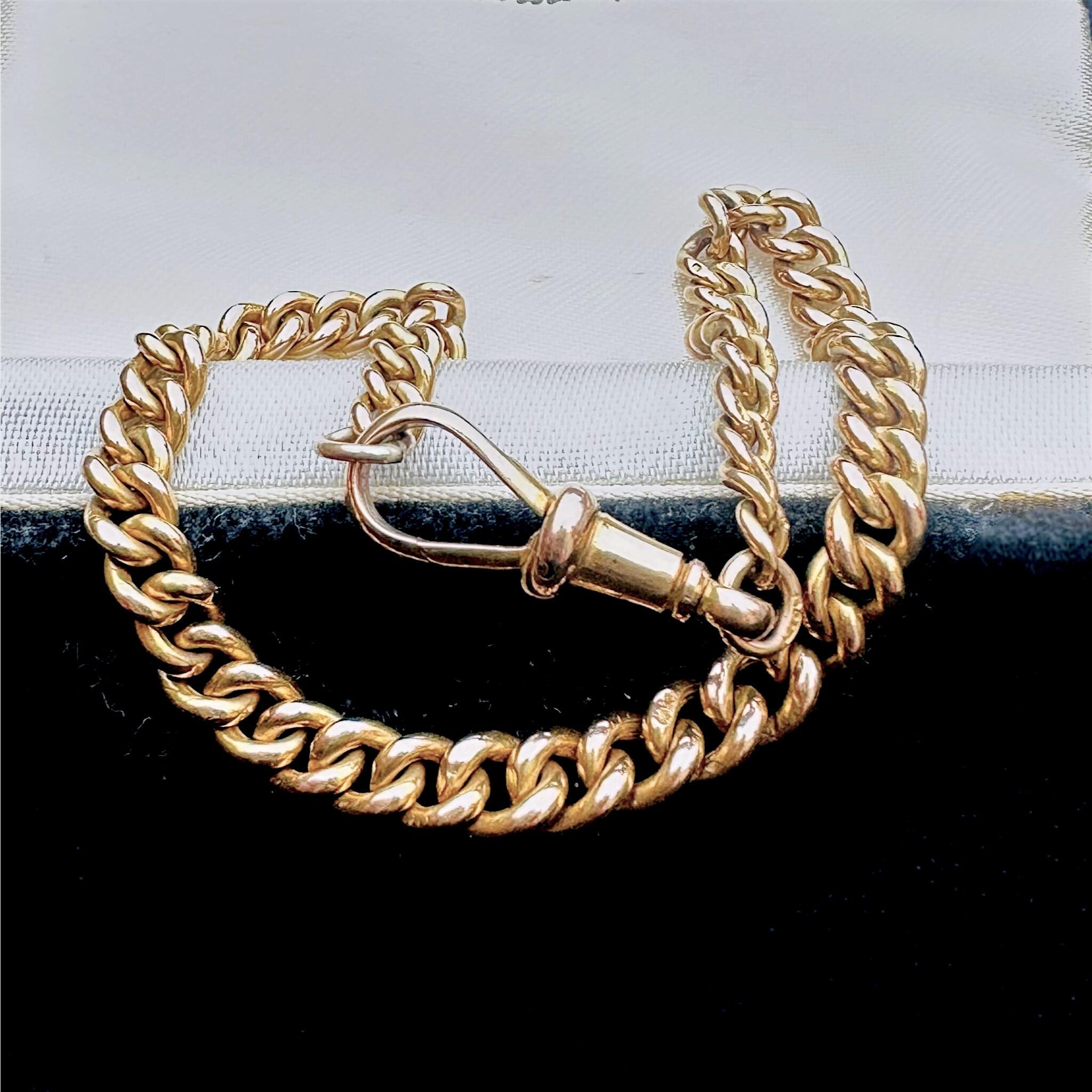 Antique Solid Rose Gold Albert Chain Bracelet & Dog Clip Clasp displayed on a antique box