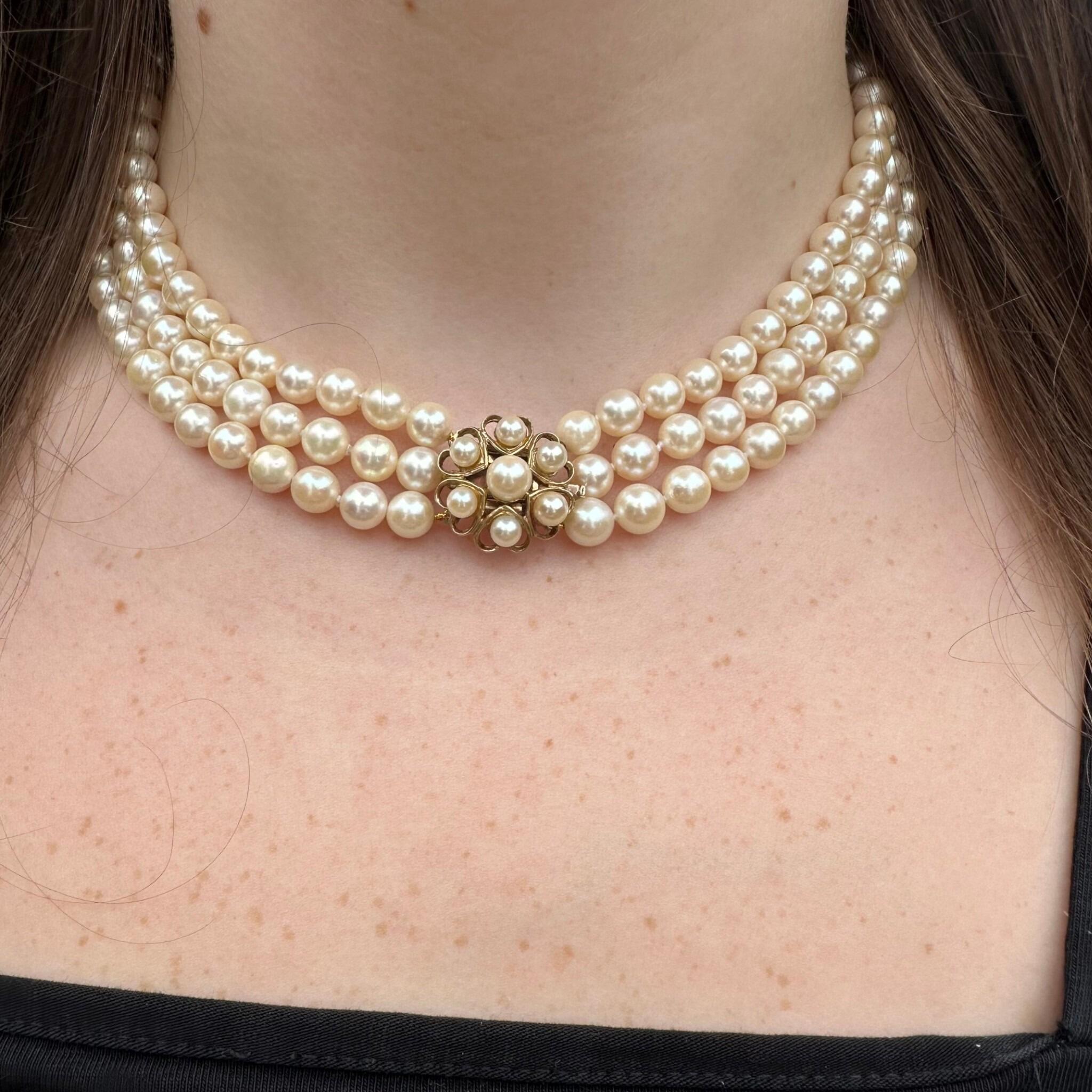 Vintage Cultured Saltwater Pearl 3 Row Necklace with Gold Pearl Cluster Heart Clasp displayed around models neck