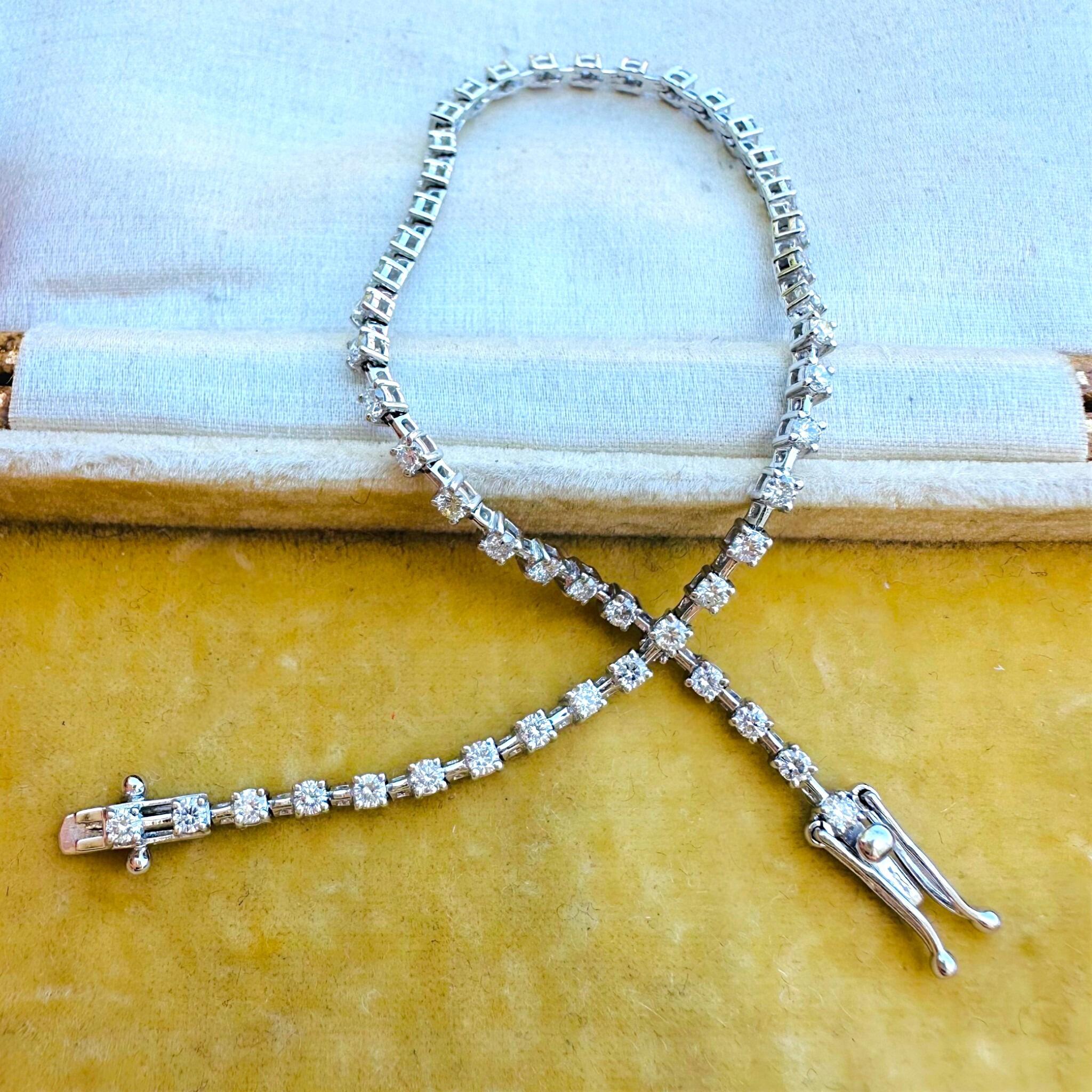 18K White Gold Diamond Tennis Bracelet laying on antique box