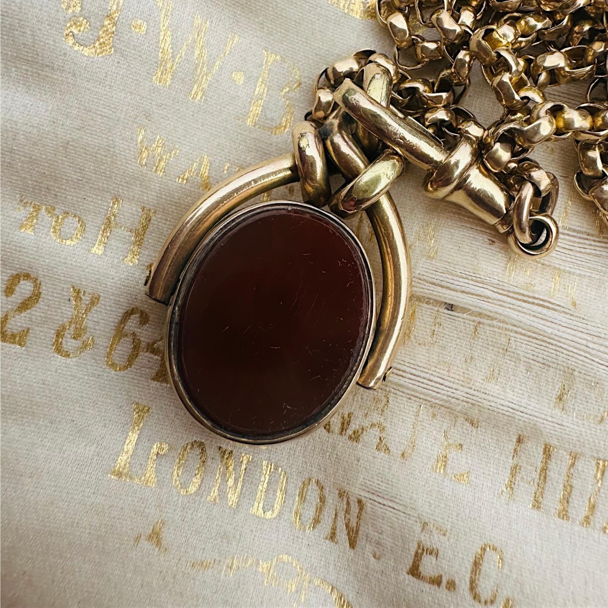 Antique Victorian 9ct Gold Bloodstone & Carnelian Swivel Fob displayed on antique box