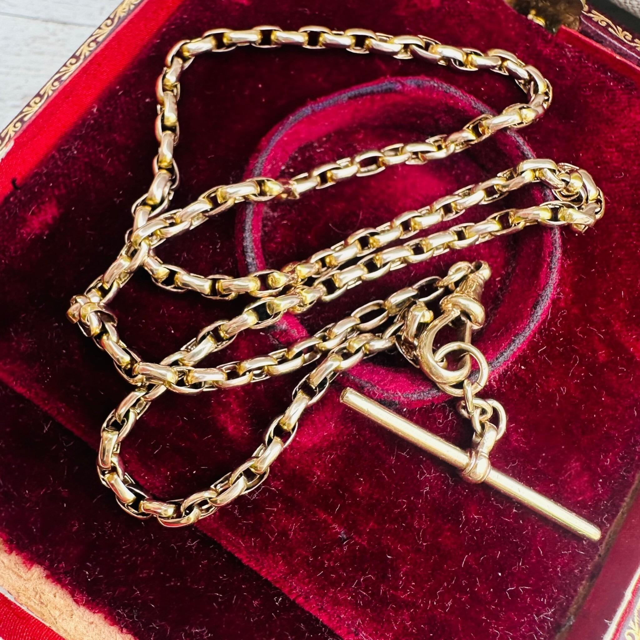 Antique Victorian Gold Bike Link Chain, Dog Clip & T-bar Clasp displayed on antique box
