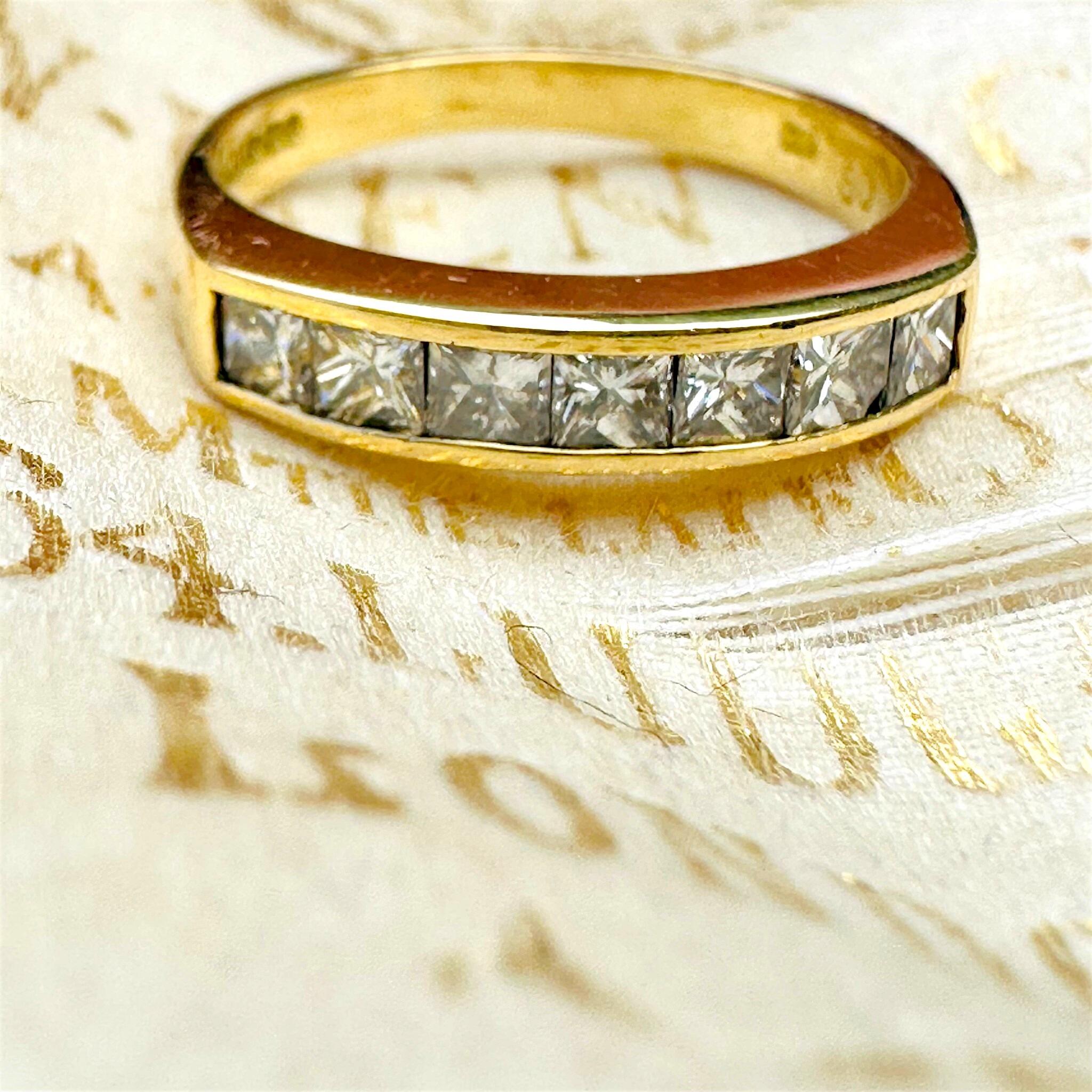 front view 18k Yellow Gold Princess Cut Diamond Half Eternity Ring laying on antique box