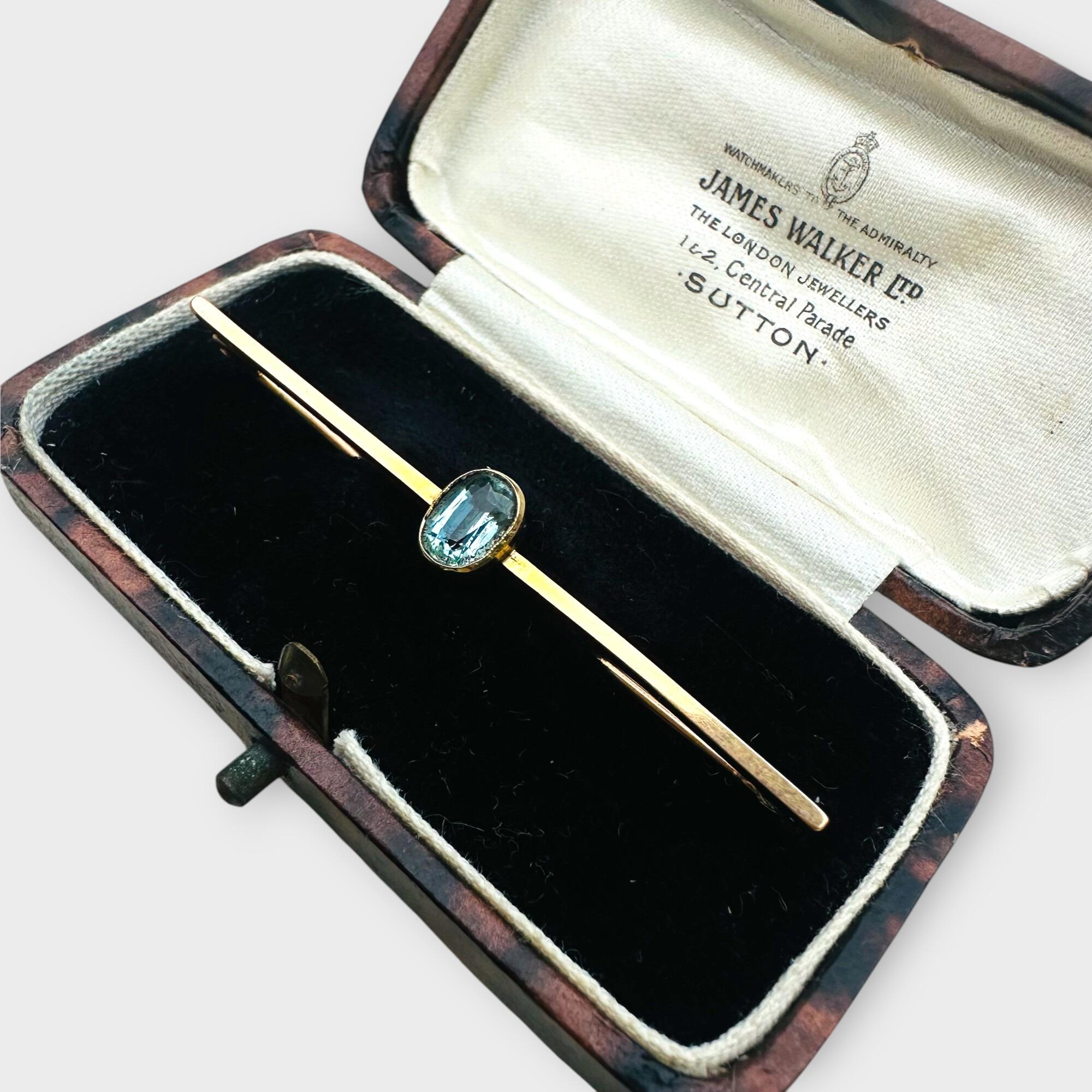 elegant Edwardian aquamarine bar brooch features a stunning 7x5mm oval aquamarine, mounted securely in a classic collet setting in antique box.