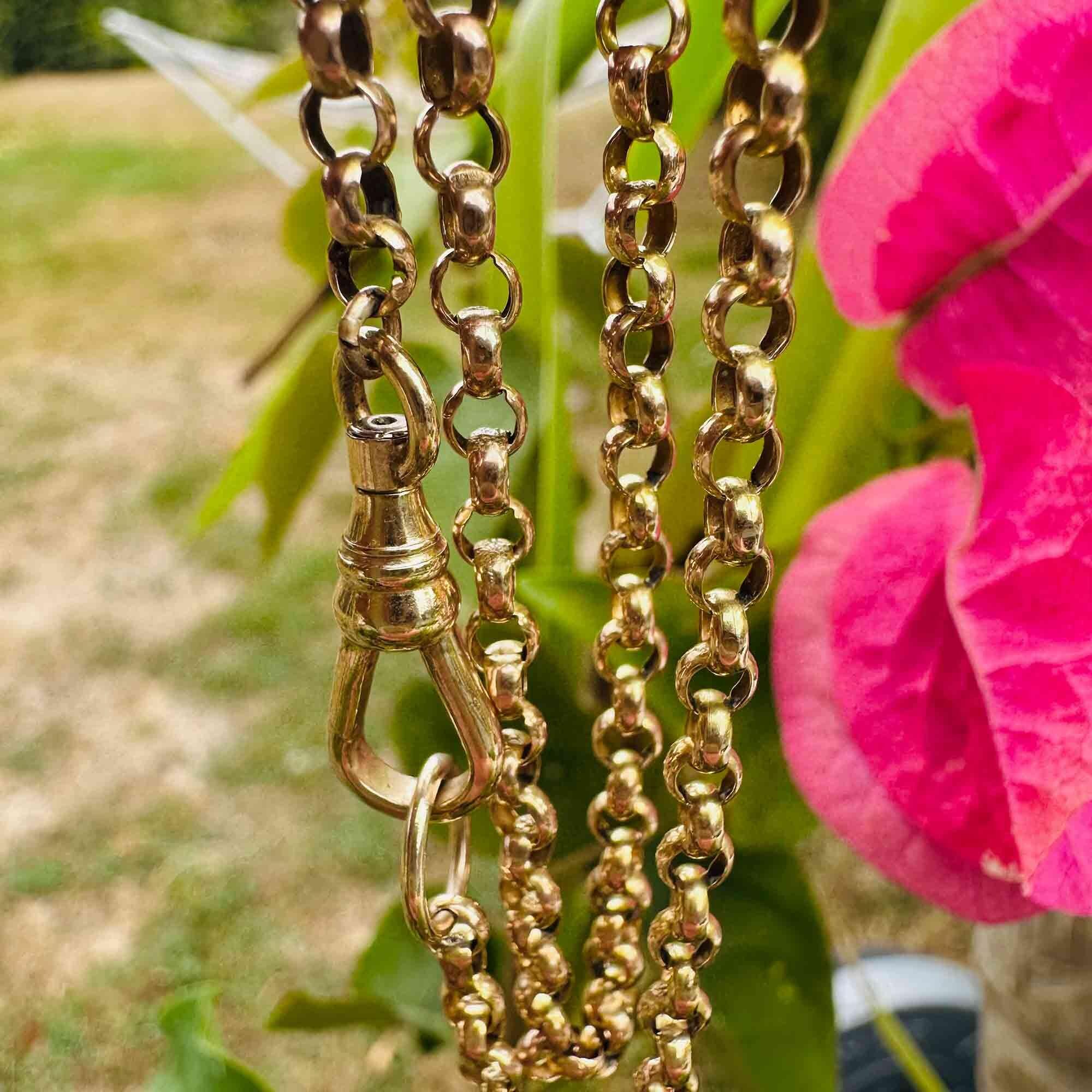 Antique 9k gold belcher chain necklace with dog clip detail, in garden.