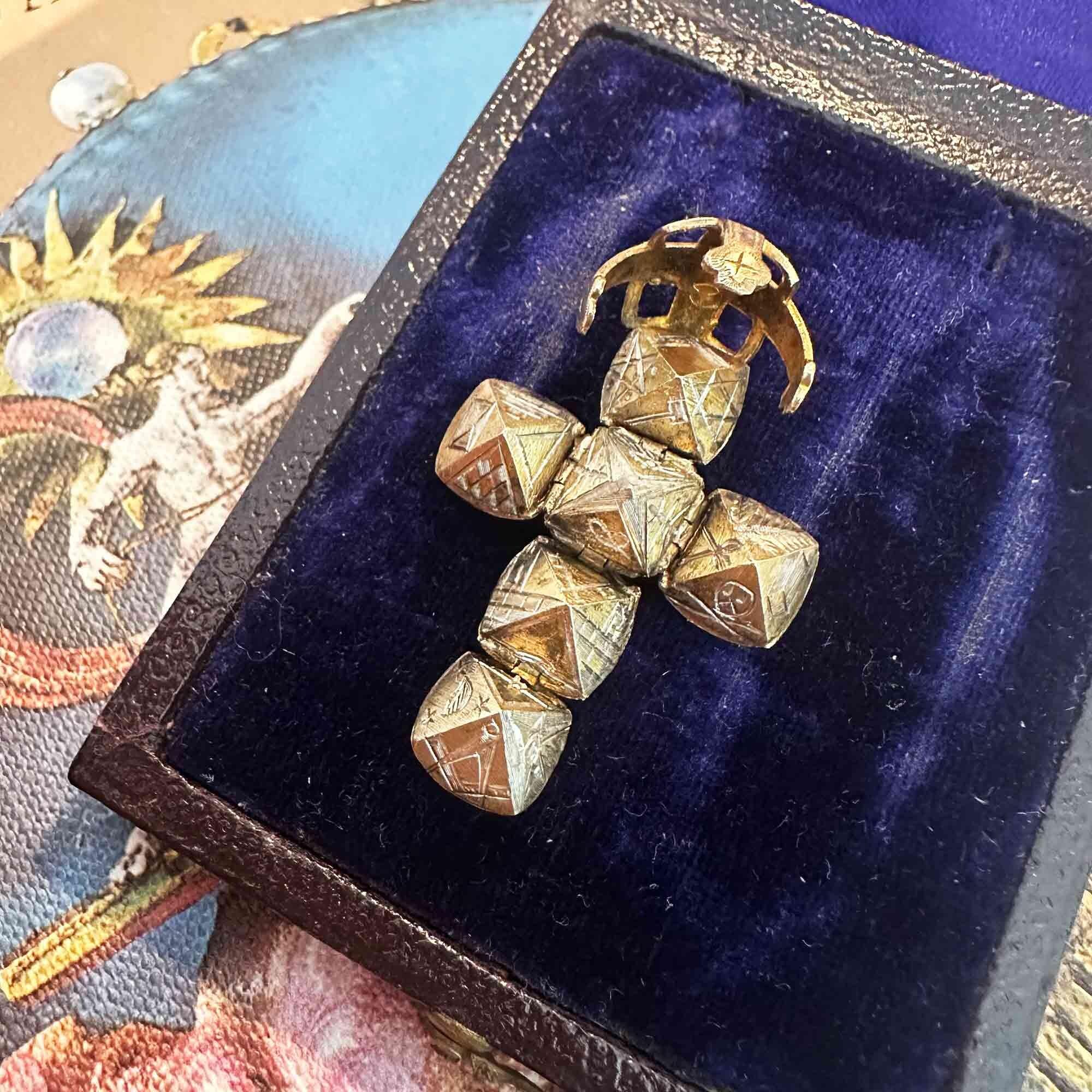 antique 9k rose gold masonic orb pendant on antique box.