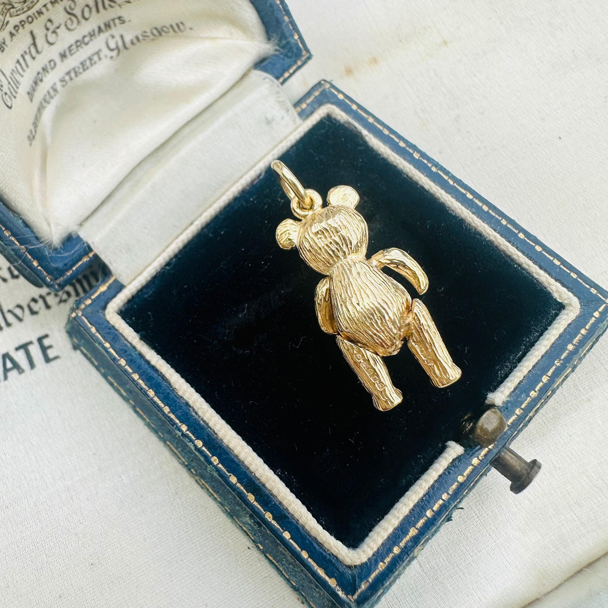 Vintage 9ct Gold Teddy Bear Pendant: Ruby Eyes, Articulated London Charm displayed in antique box