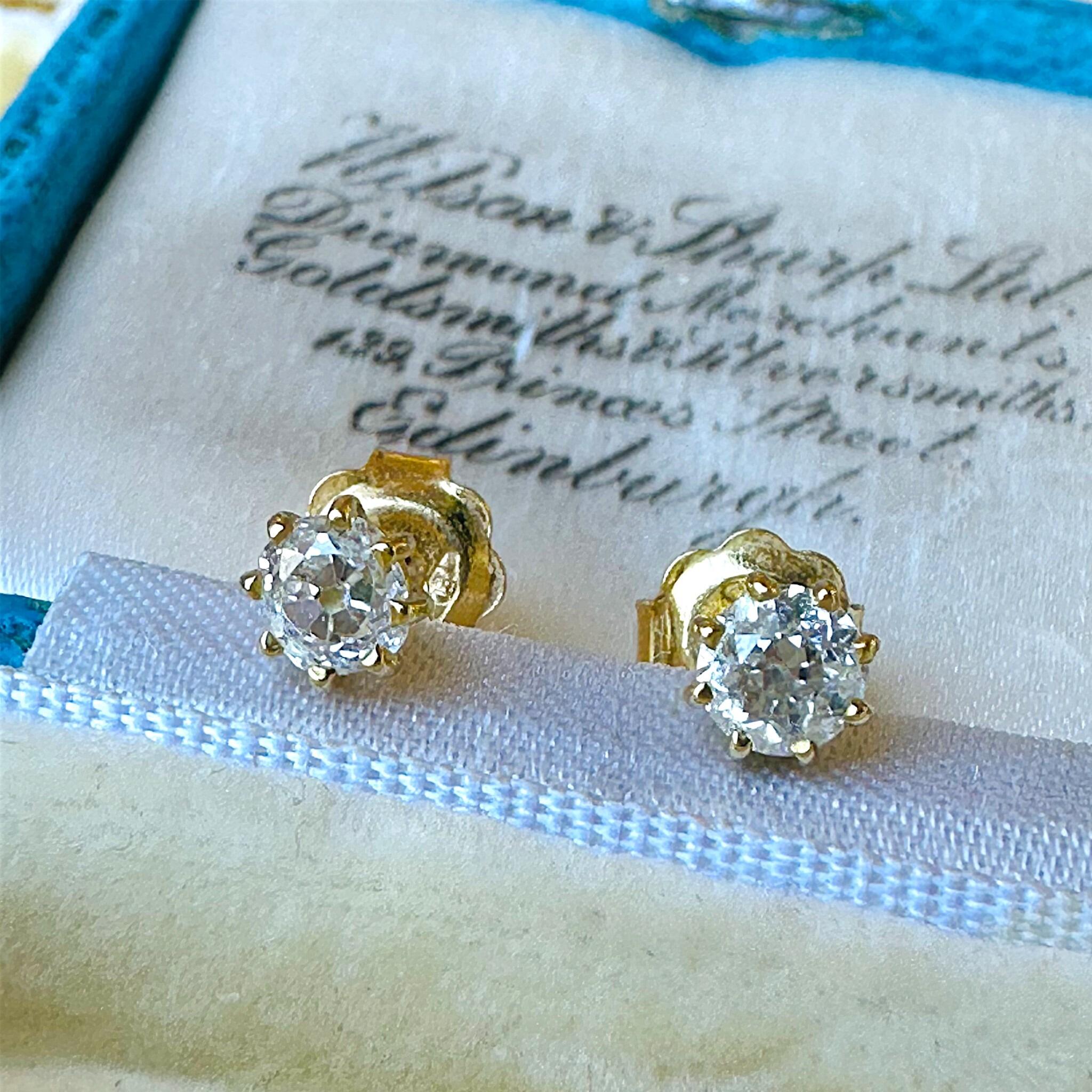 Old European Cut Diamond Earrings: 18k Gold Solitaire Studs (0.80ct) displayed on antique box