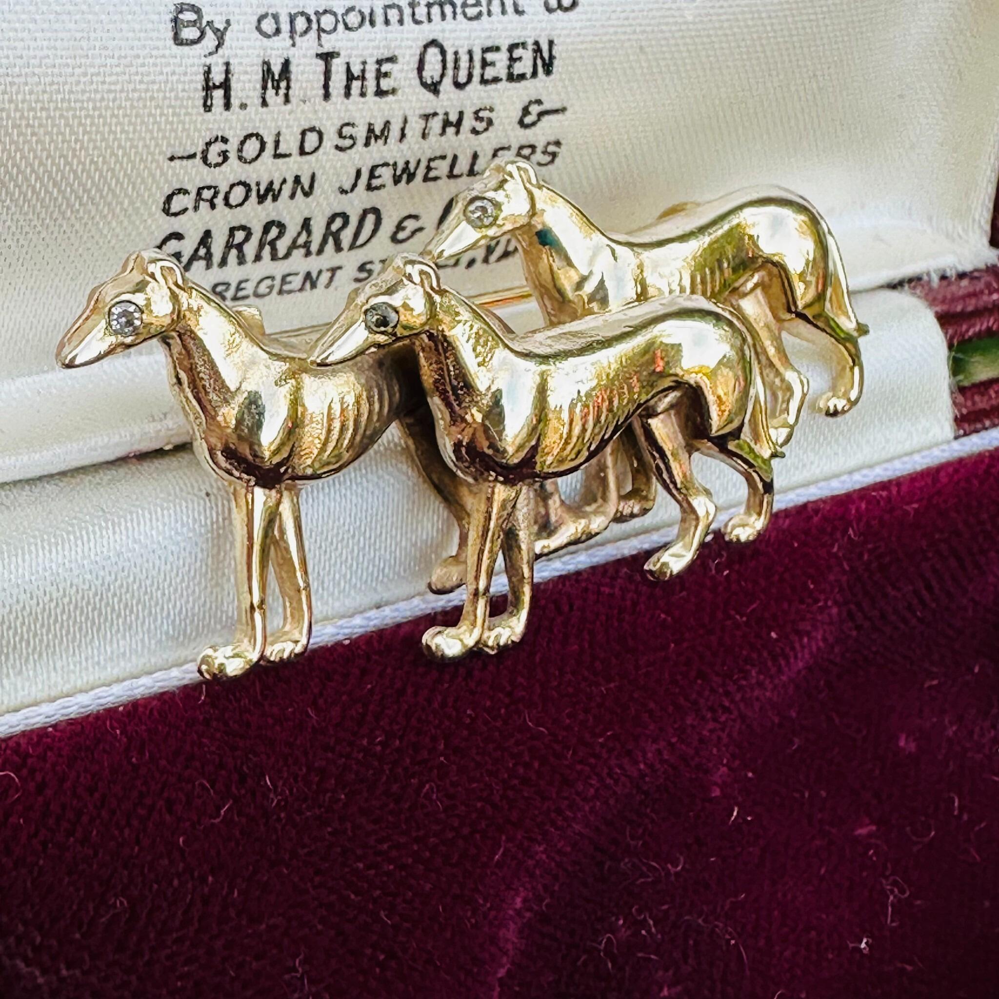 Rare, Antique 15k Gold Triple Greyhound Brooch with Diamond Eyes, displayed in antique box.