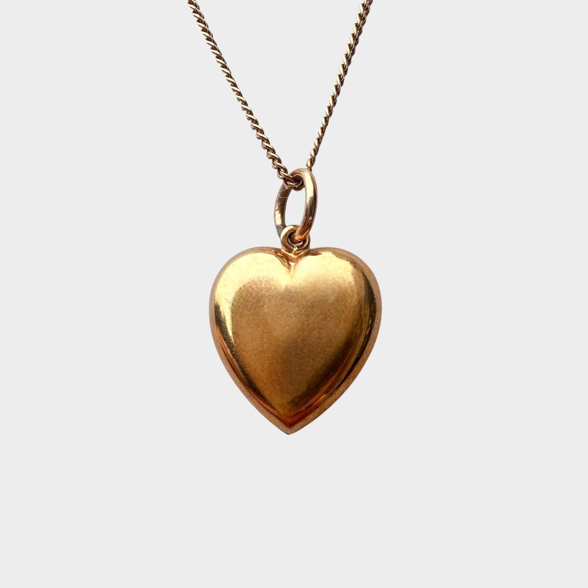 Gold Puffy Heart Necklace with Chain Dating 1942, grey background