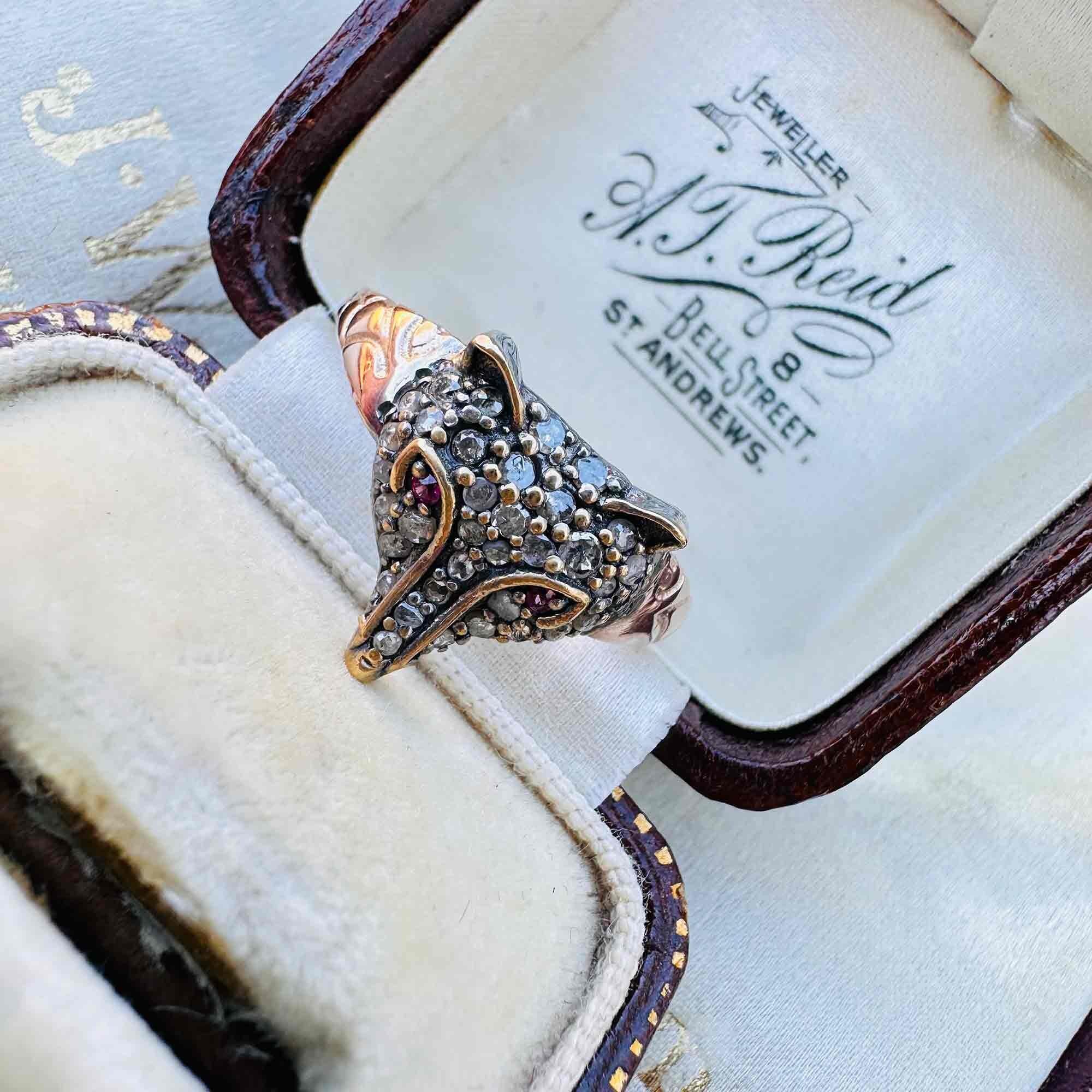 Front view of Rose Gold, Silver & Diamond & Ruby Eyed Fox Ring displayed in antique box