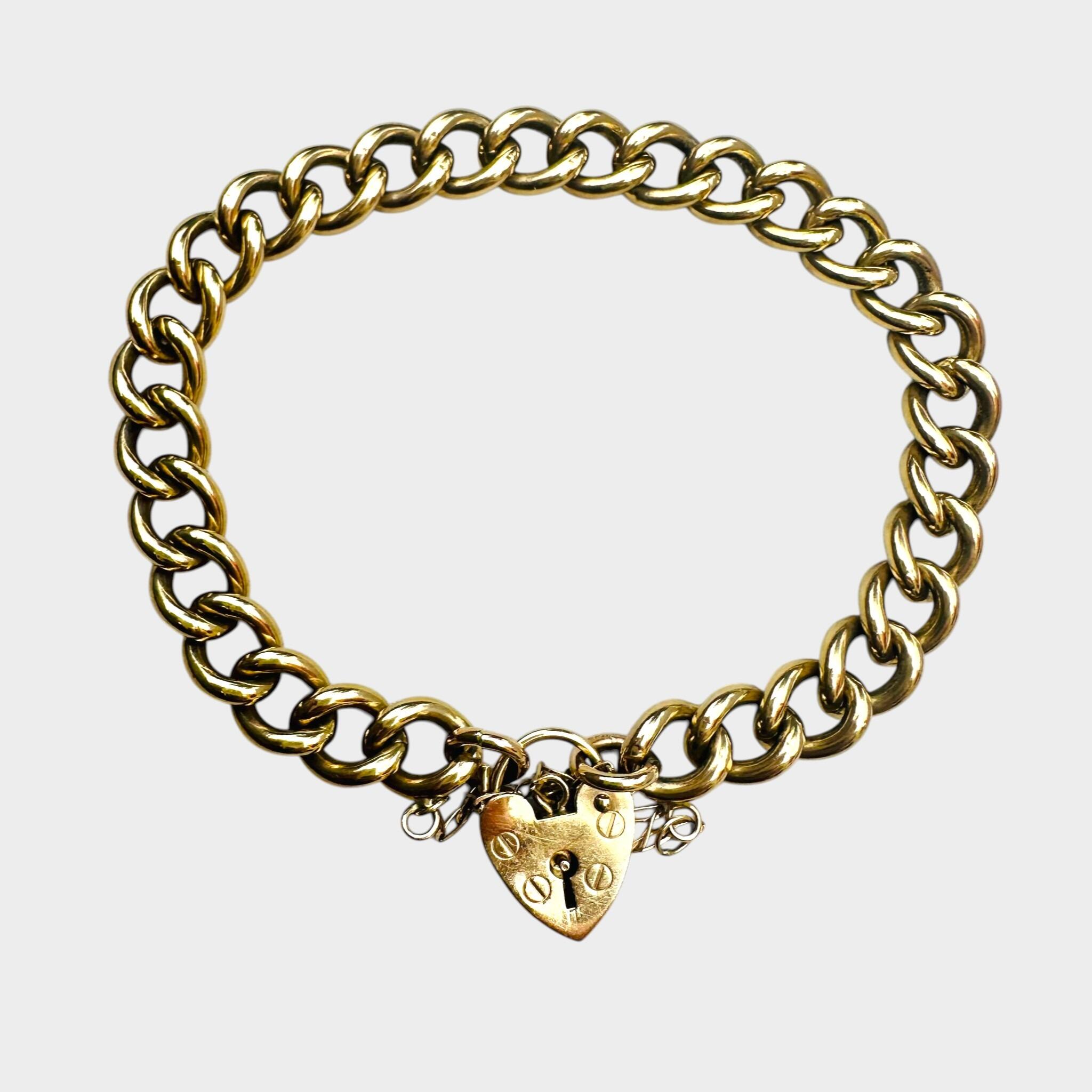Heavy, Chunky Gold Curb Bracelet & Heart Padlock with grey backround