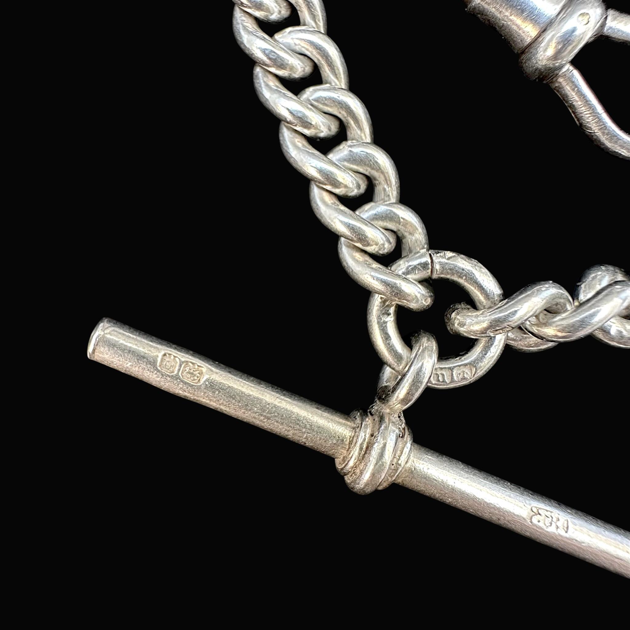 close up up of Antique Chunky Silver Albert Chain Necklace, T-Bar & Dog Clip with black background