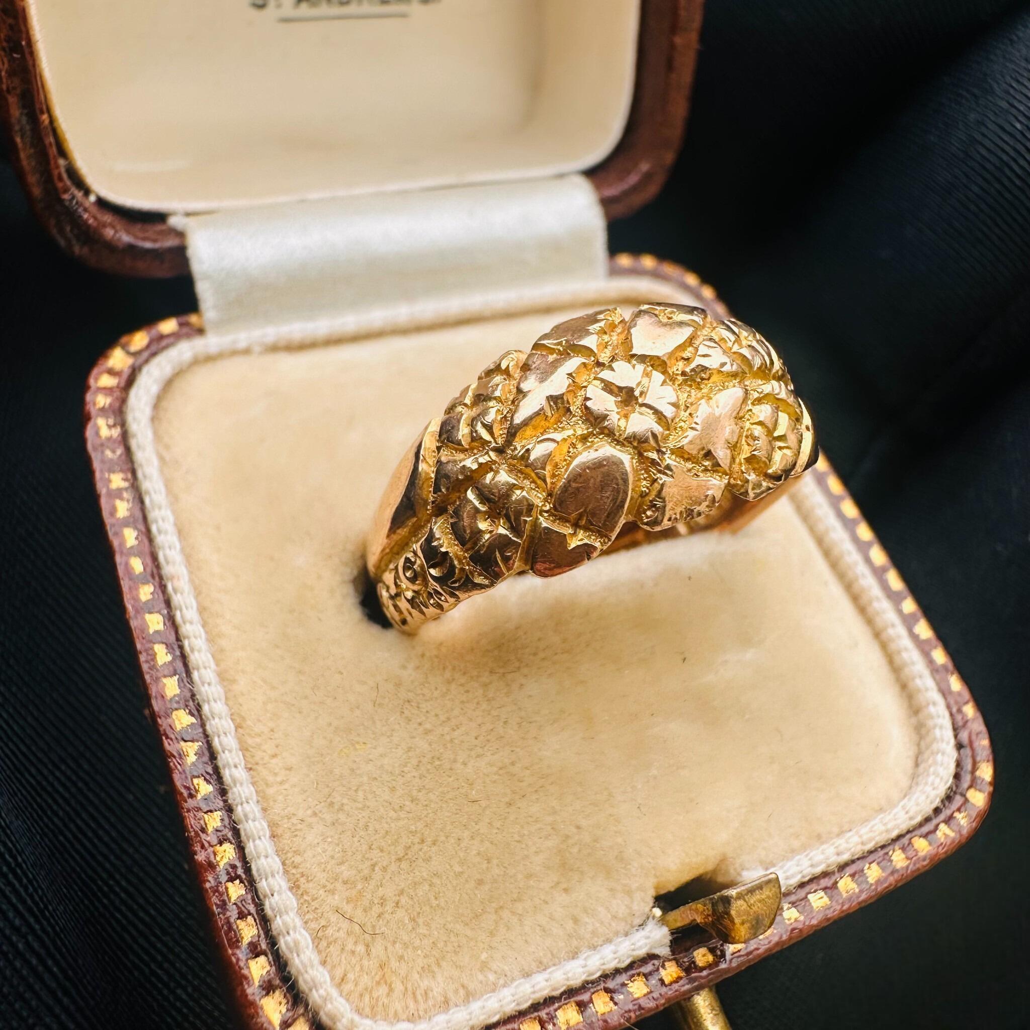 side profile of Antique Art Nouveau Gold English Repoussé Ivy & Rose Dress Ring displayed in antique box, with black background.