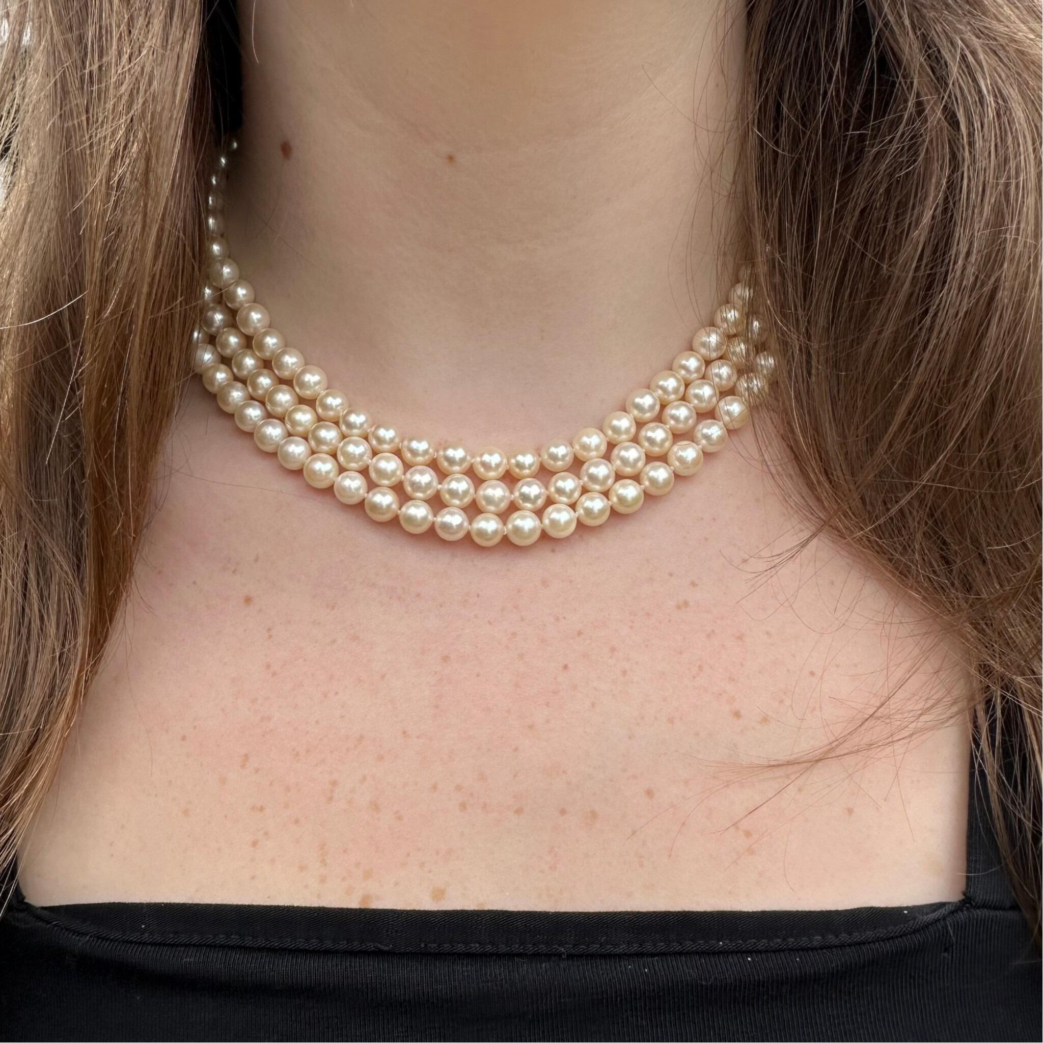 Vintage Cultured Saltwater Pearl 3 Row Necklace with Gold Pearl Cluster Heart Clasp displayed around models neck