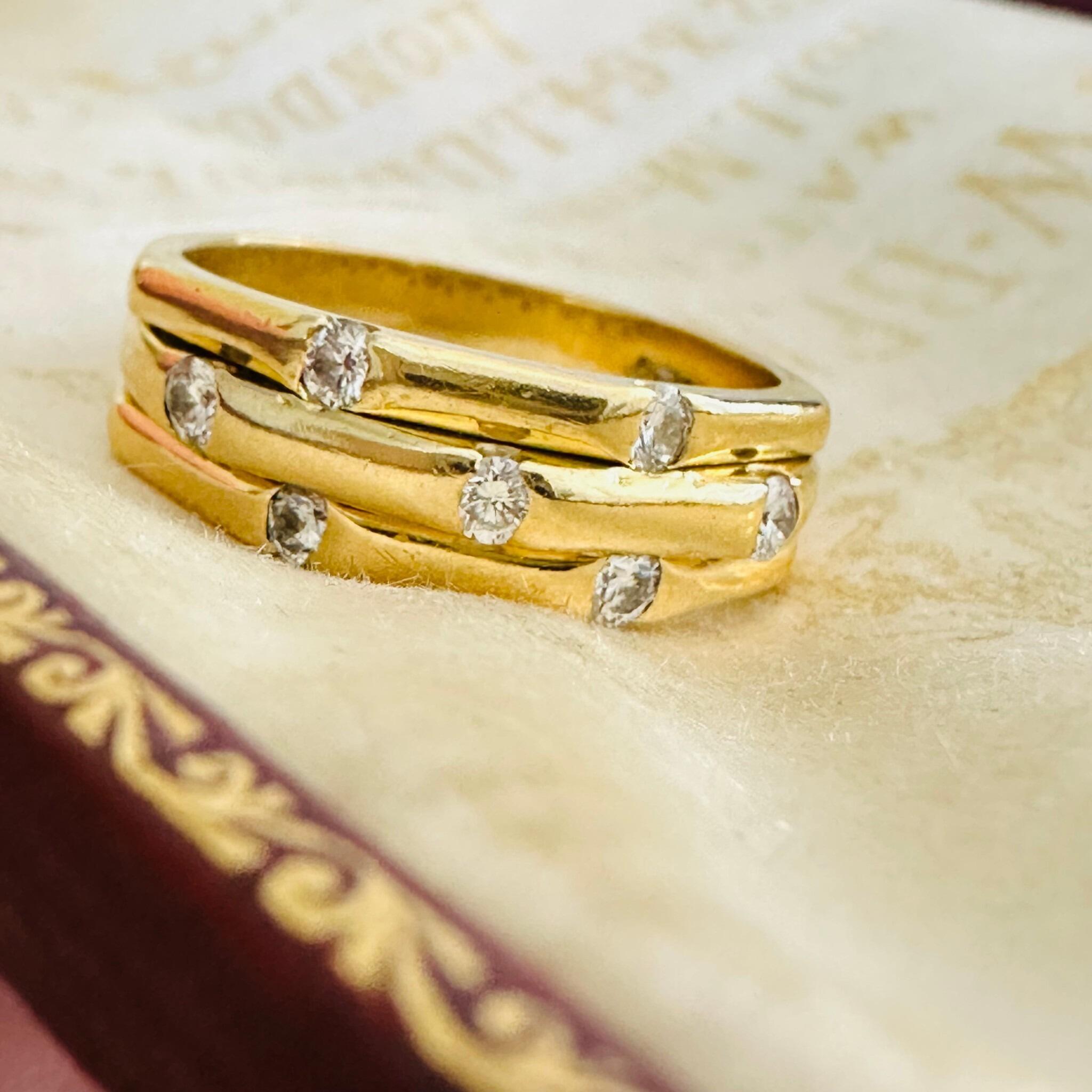 Vintage 18k Gold Diamond 0.35ct's Bamboo Ring, laying on antique box