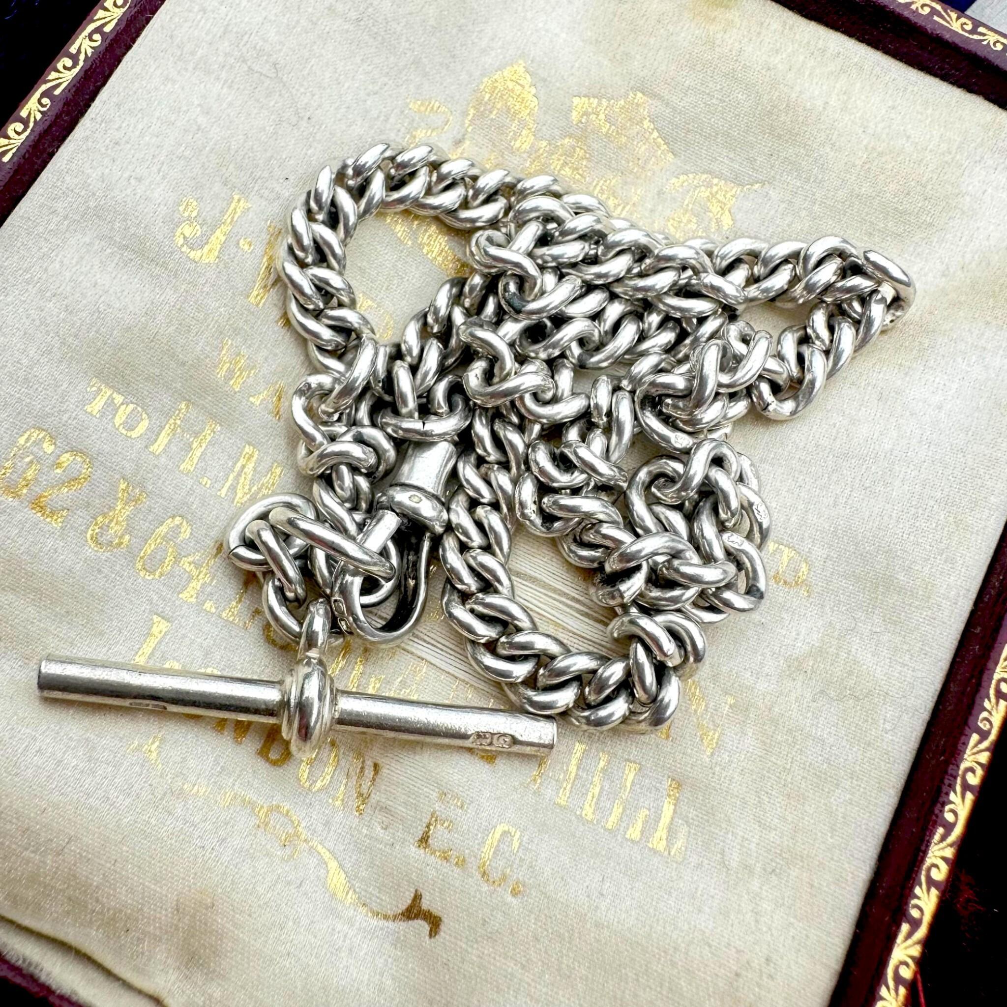 Antique Edwardian Sterling Silver Albert Chain, T Bar & Dog Clip displayed on antique box