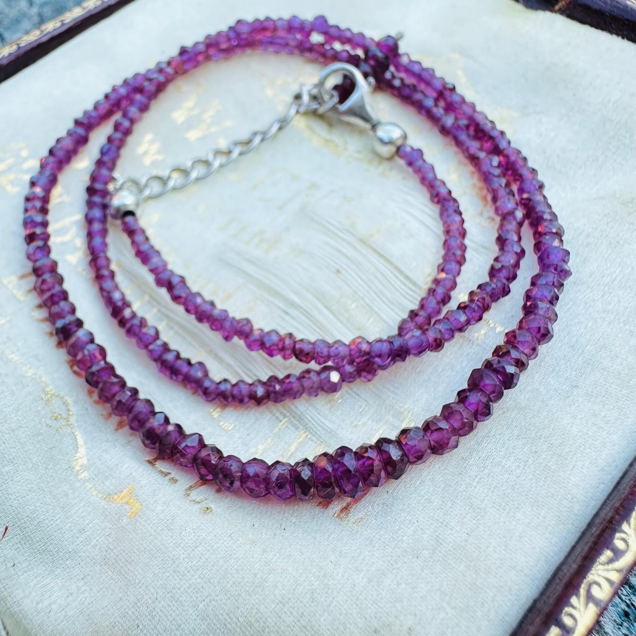 Silver & Amethyst Bead Necklace displayed on antique box