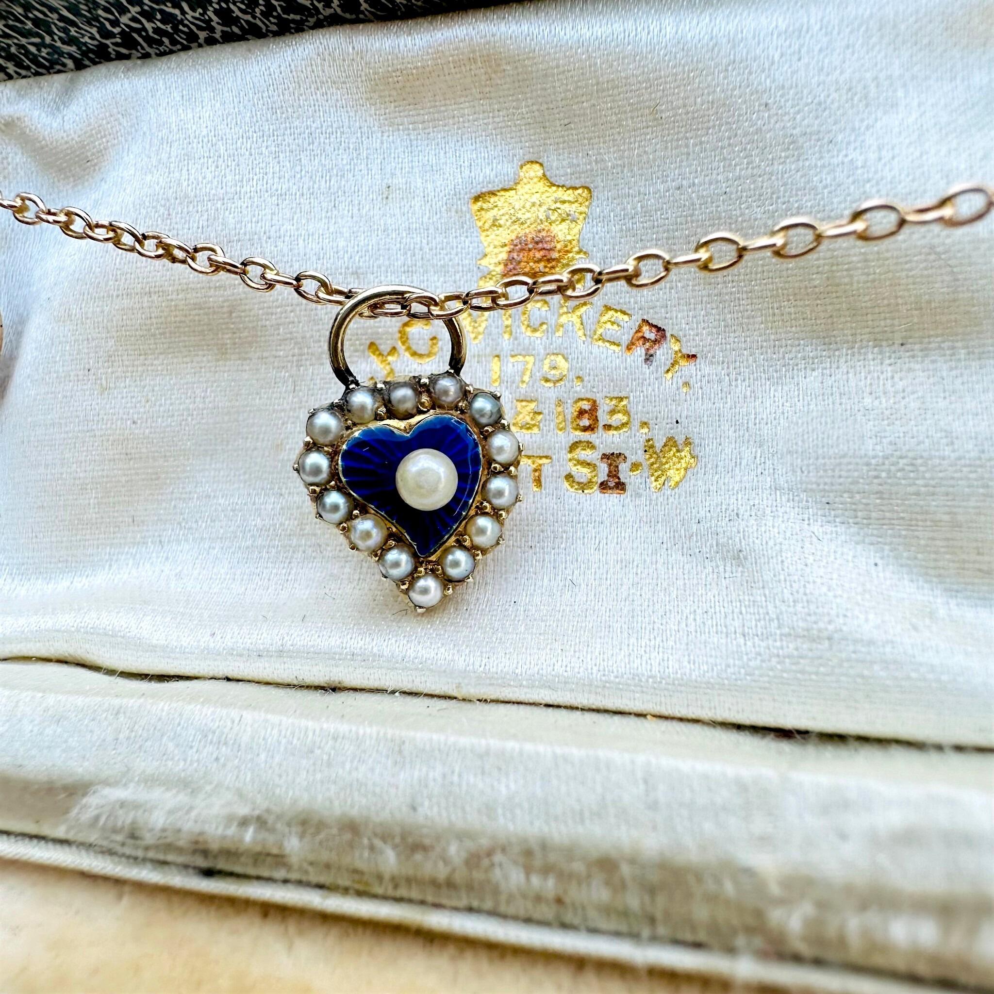 Antique Victorian 15ct Gold Puffy Heart Pendant displayed on gold chain