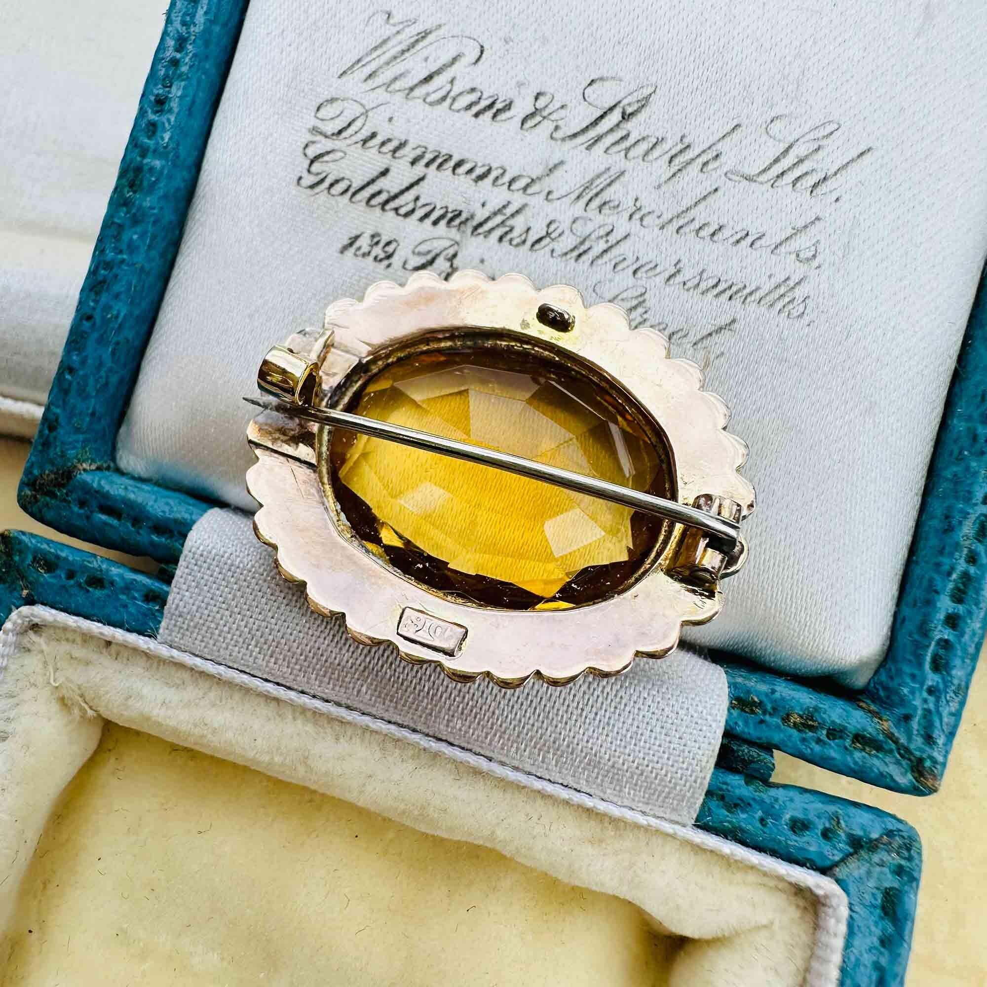 rear view of Victorian citrine and pearl brooch in 9ct rose gold, displayed in antique box.
