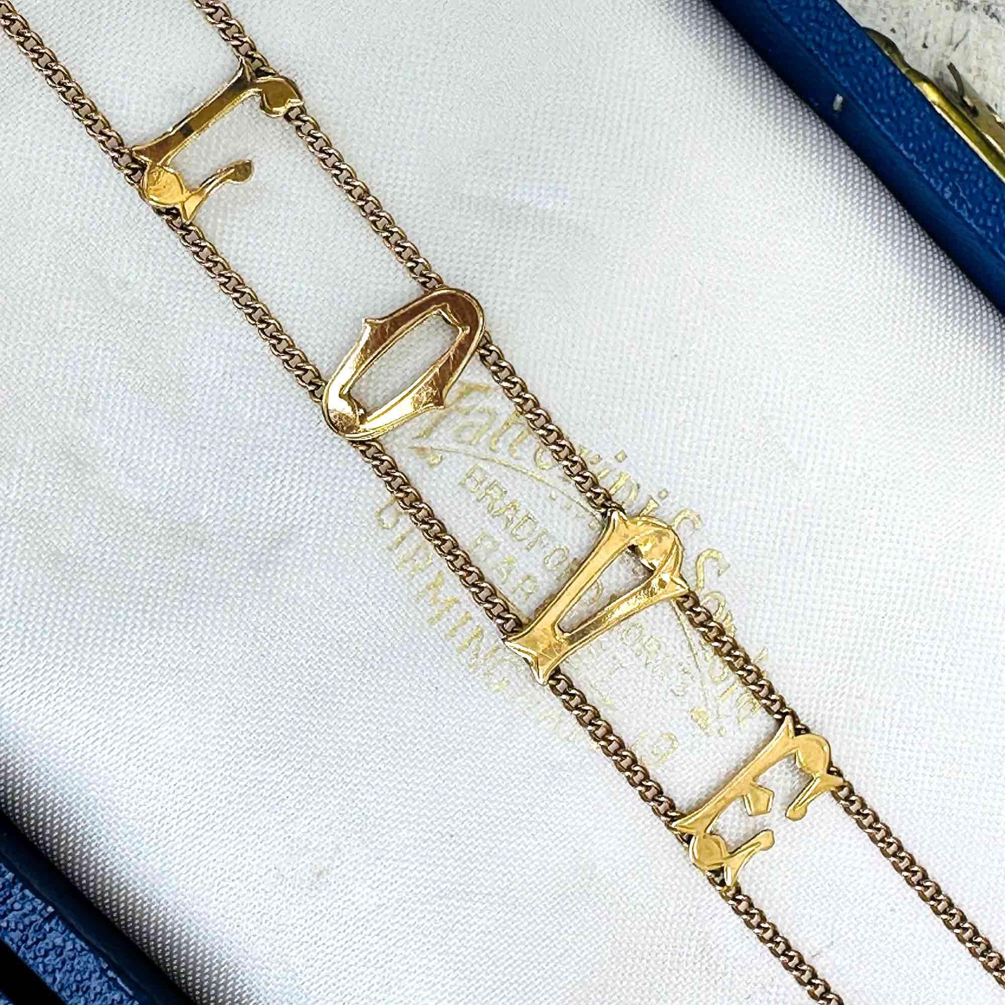 Vintage 9ct gold bracelet with "I Love You" links, front view