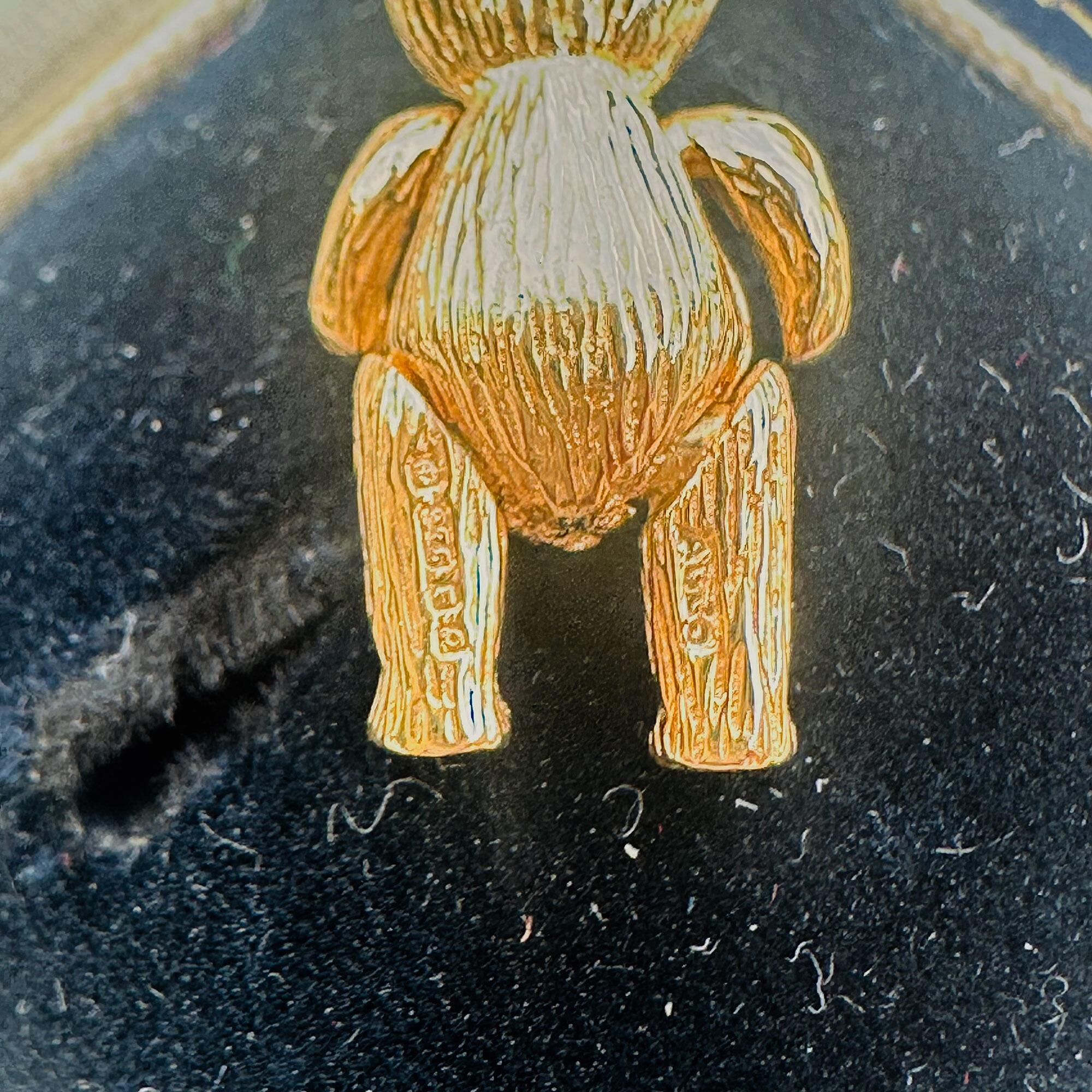 Vintage 9ct Gold Teddy Bear Pendant: Ruby Eyes, Articulated London Charm displayed in antique box