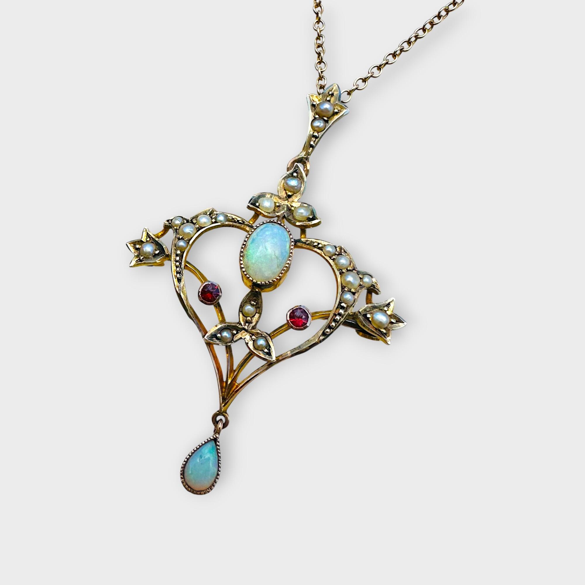 Art Nouveau 9k gold pendant brooch with opals, rubies, and pearls