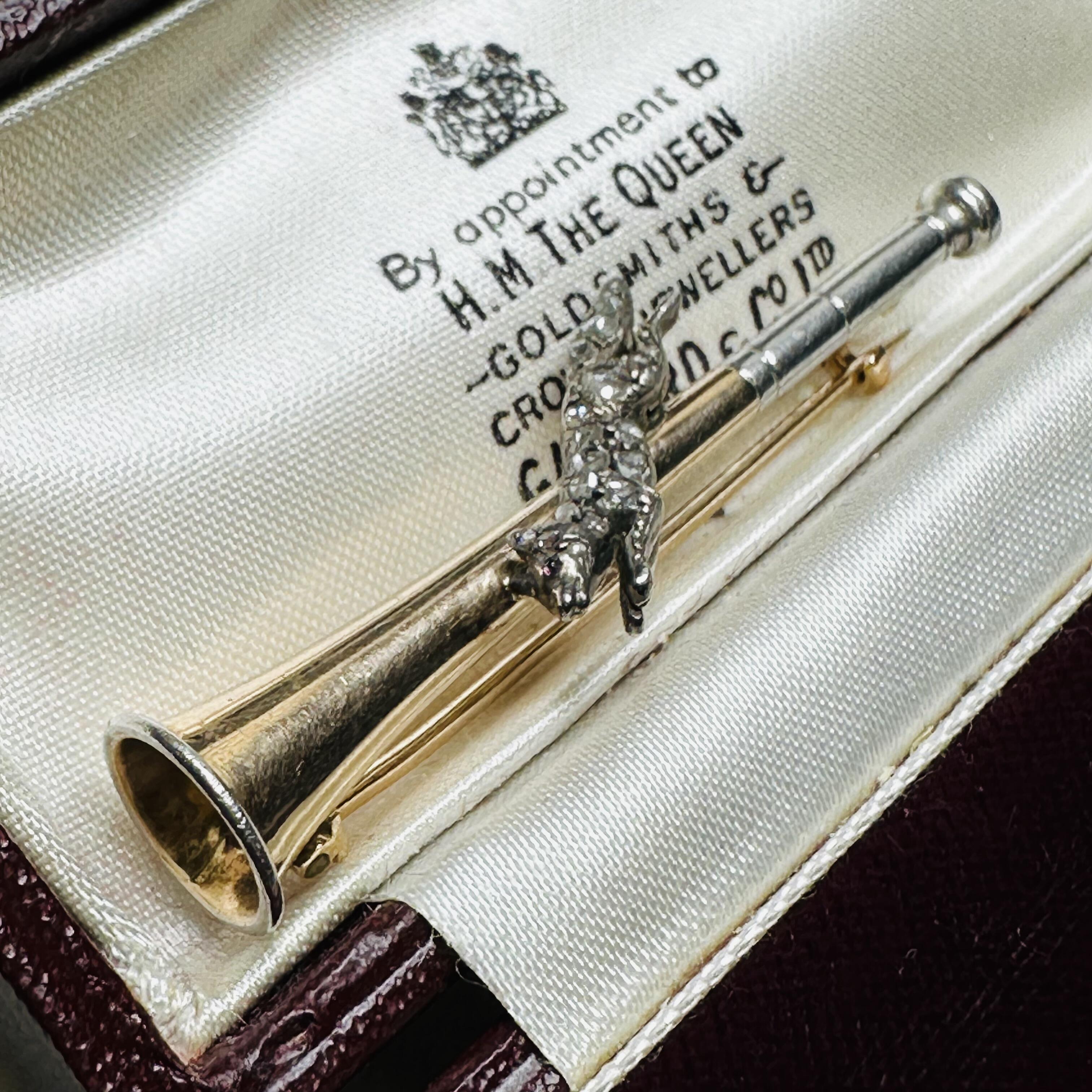 15ct Gold & Platinum, Diamond Running Fox on Bugle Brooch, displayed in antique box