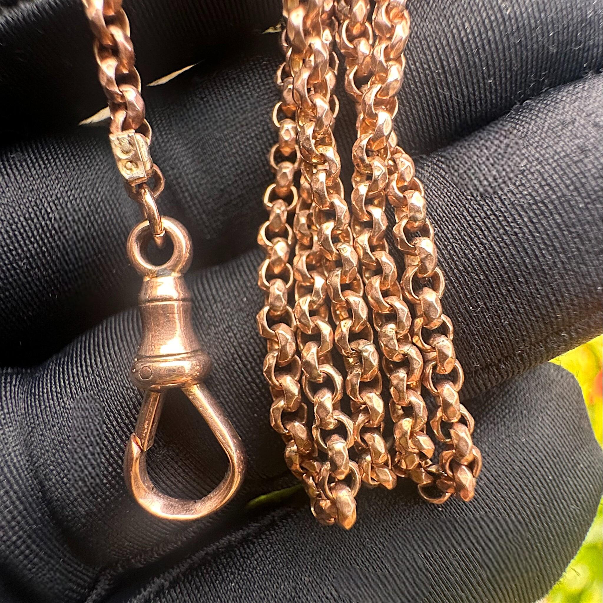 Rose Gold Faceted Belcher Chain with Dog Clip Clasp held in gloved hand.