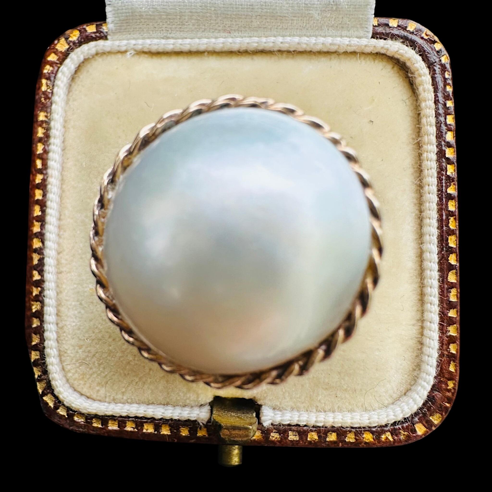 Vintage 9k Gold Mabe Pearl Cocktail Ring displayed in antique box with black background