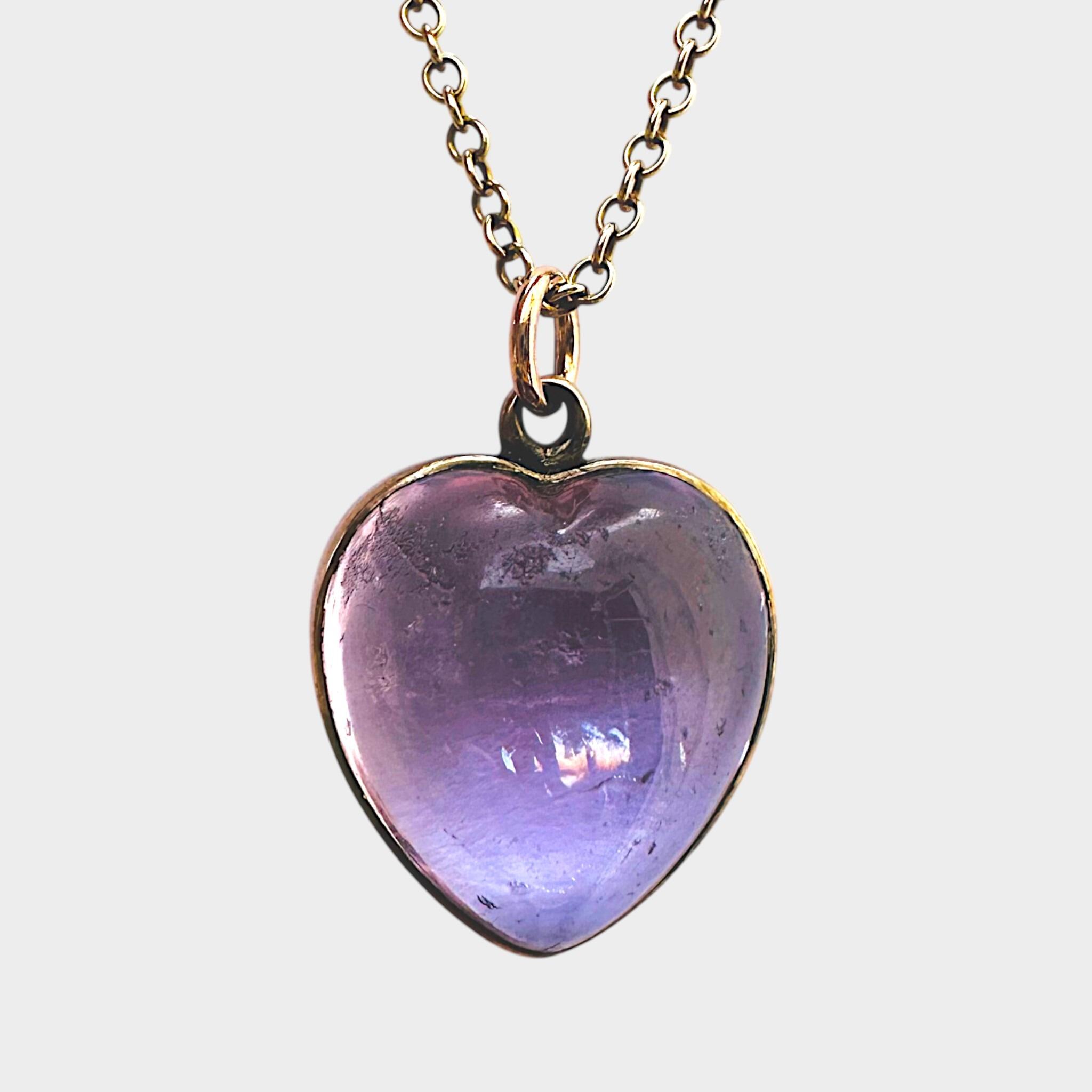 close up of Rose de France Amethyst Heart Pendant & Gold rolo link chain grey background