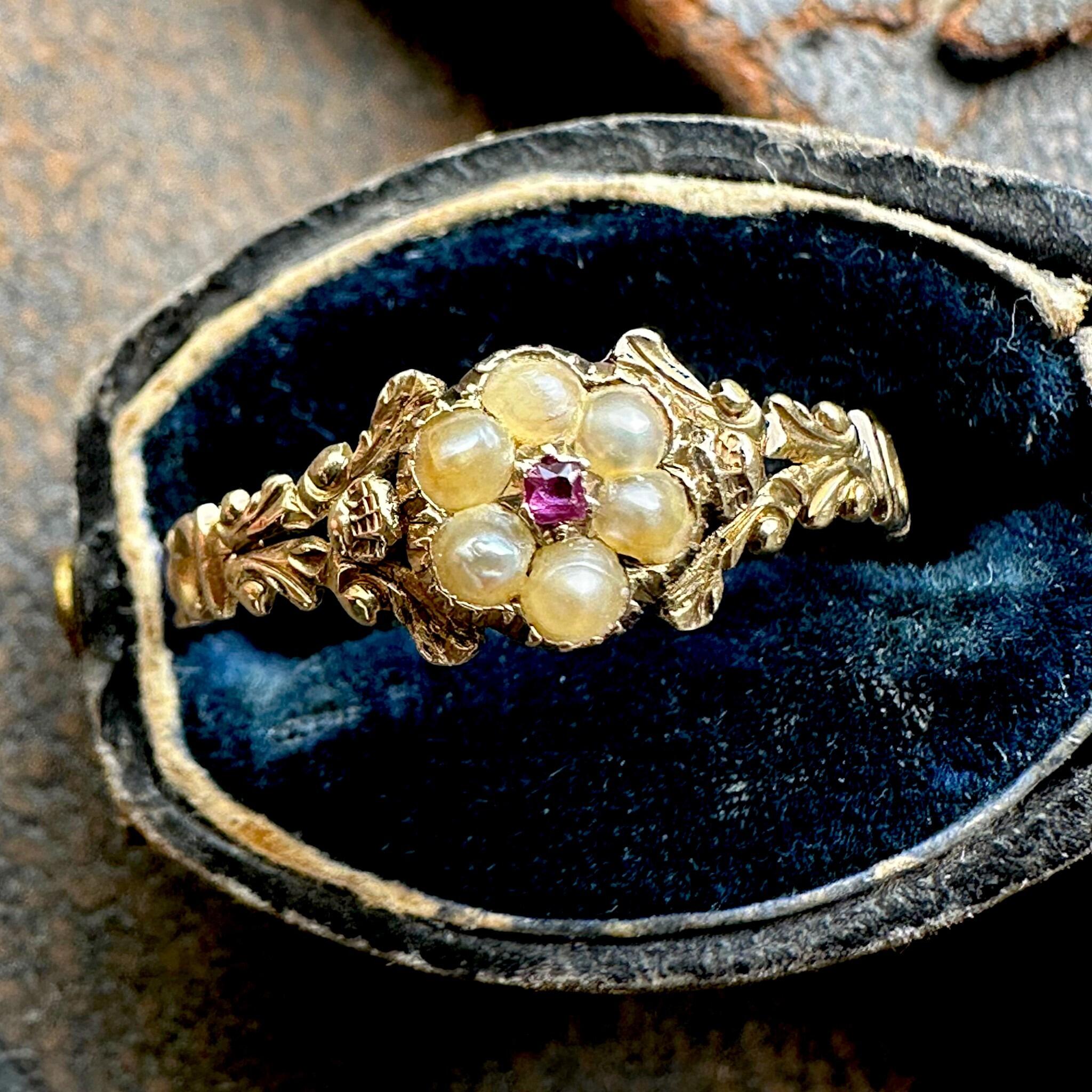 top view of Antique Georgian Regency Pearl & Ruby Daisy Ring displayed in antique box