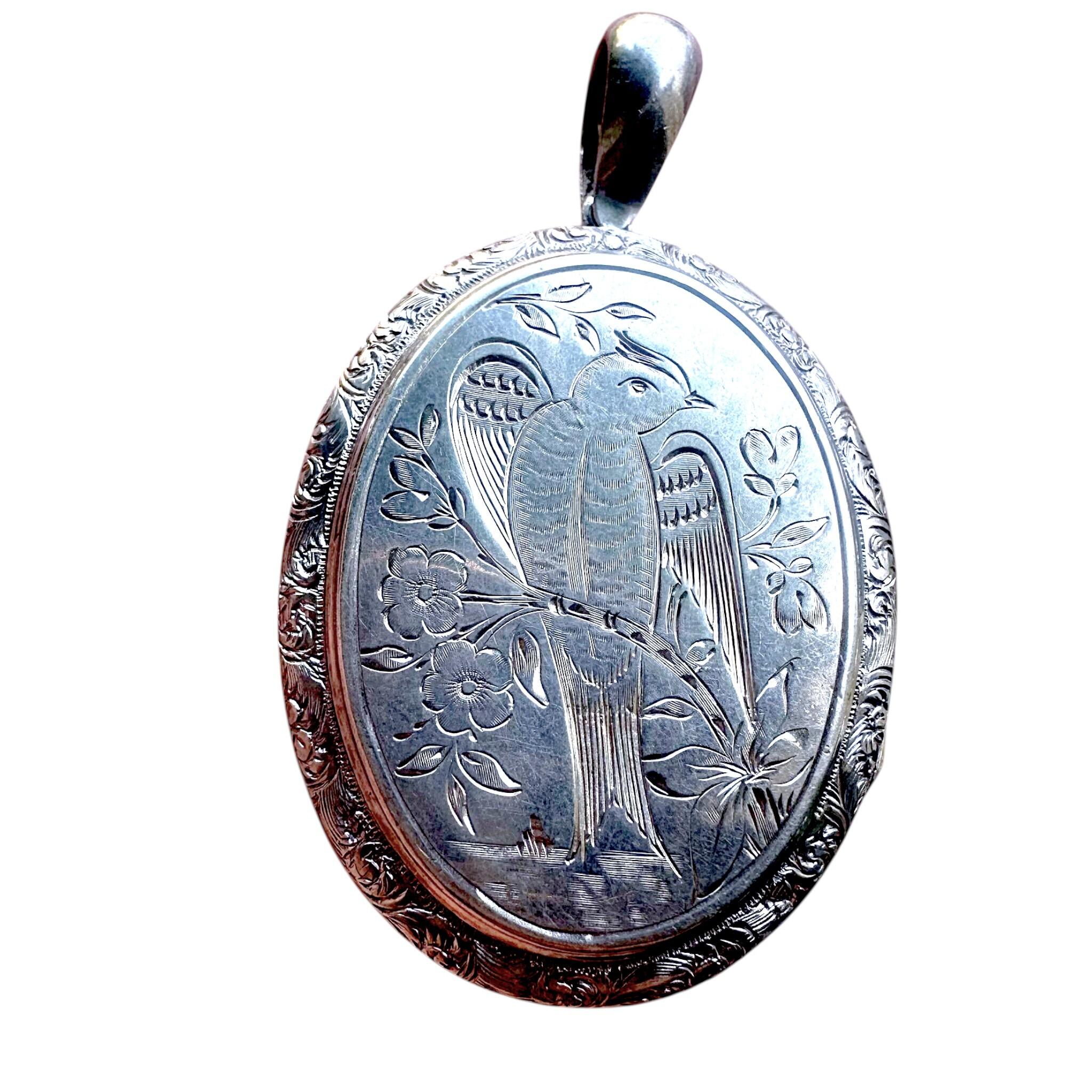 Antique Victorian Silver Engraved Bird Locket Pendant with white background