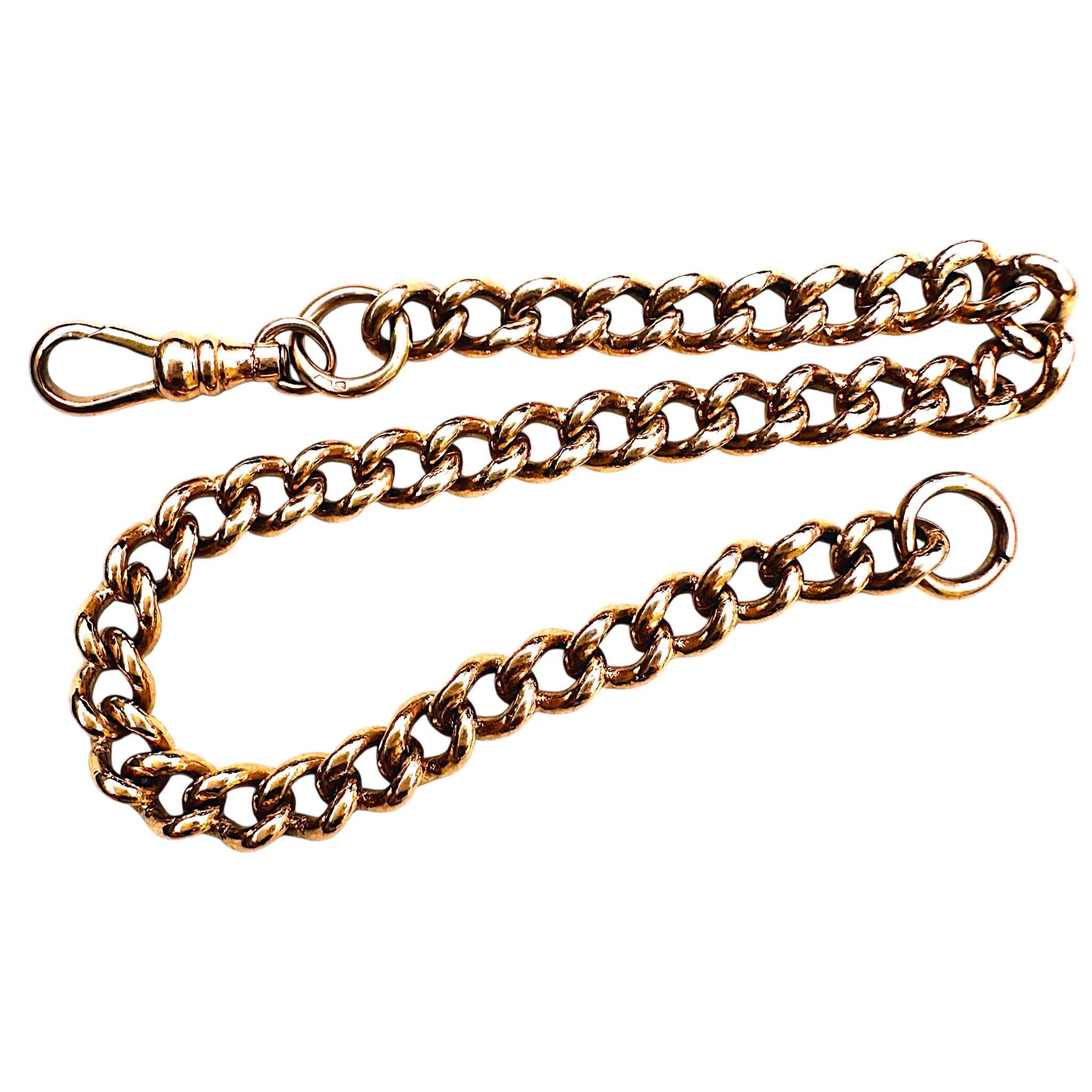 side profile of Antique Rose Gold Curb Link & Dog Clip Bracelet with white background