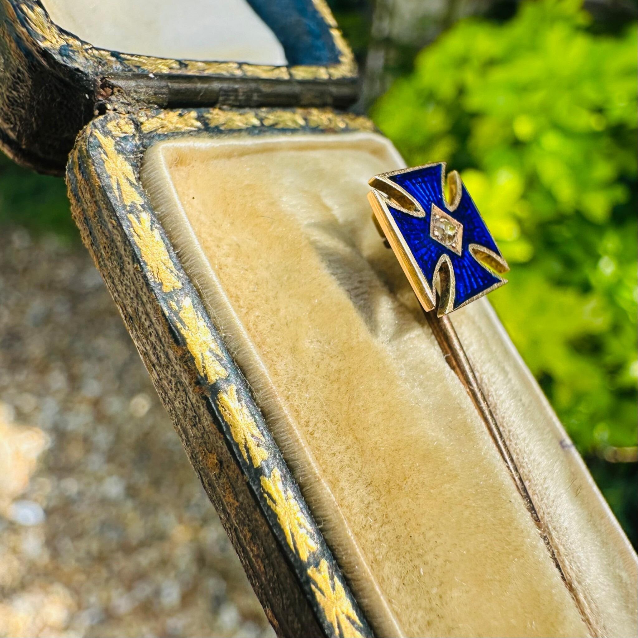 side profile of Antique Victorian Gold Maltese Cross Stick Pin & Original Box in garden