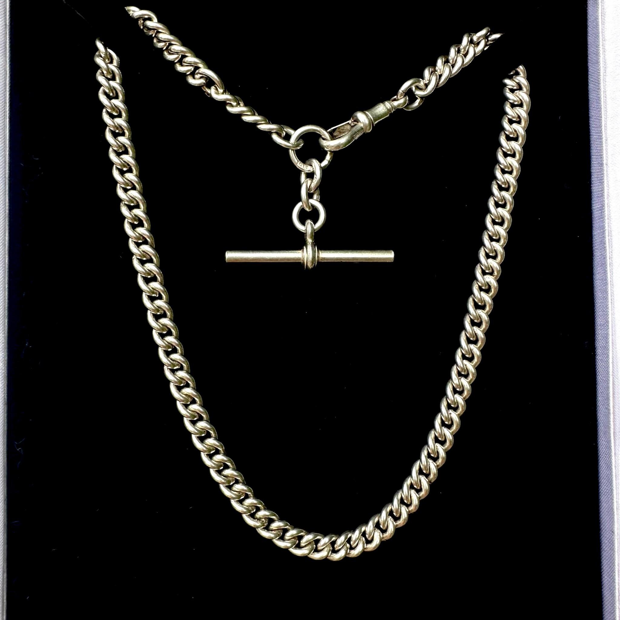 Antique Edwardian Sterling Silver Albert Chain, T Bar & Dog Clip displayed on black velvet