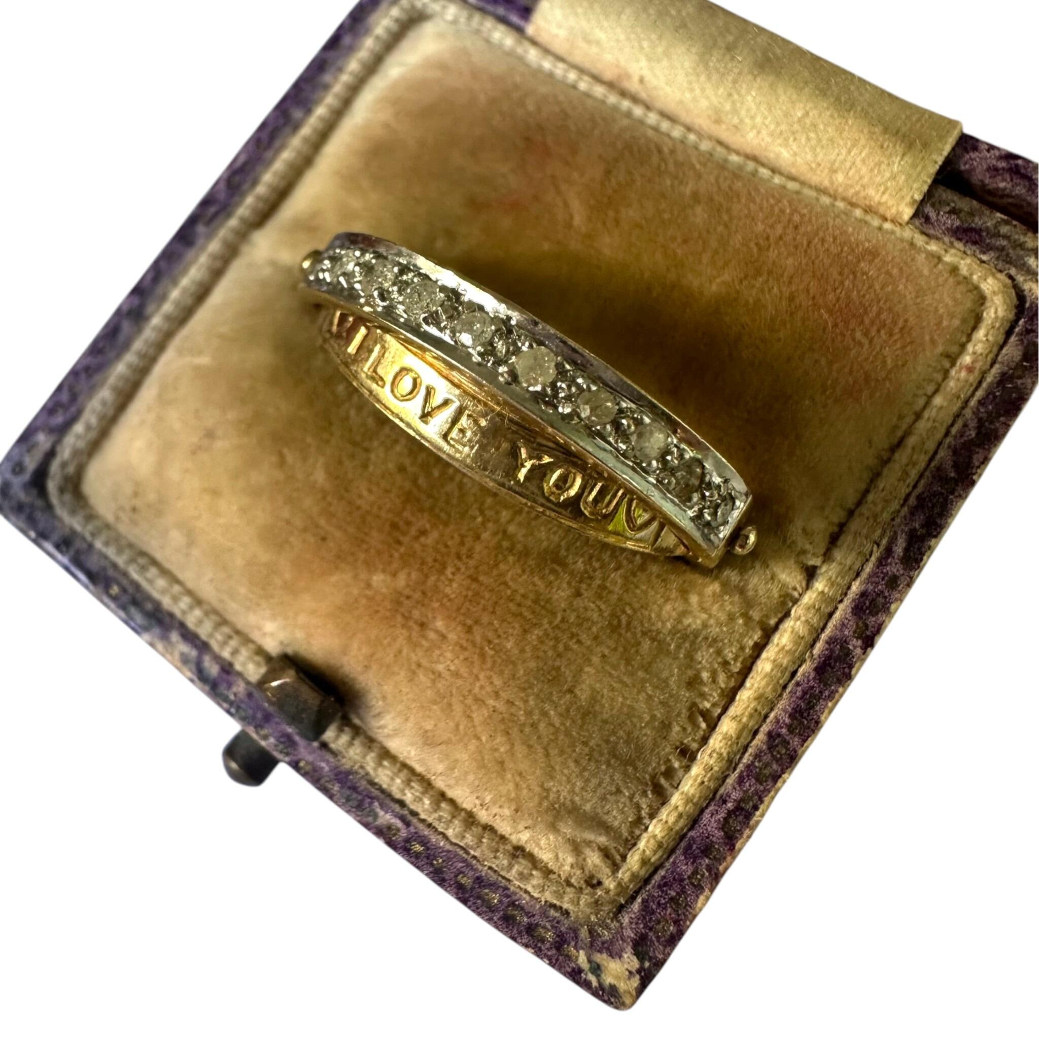 side profile of Vintage Gold & Diamond Secret Message "I Love You" Ring displayed in antique box