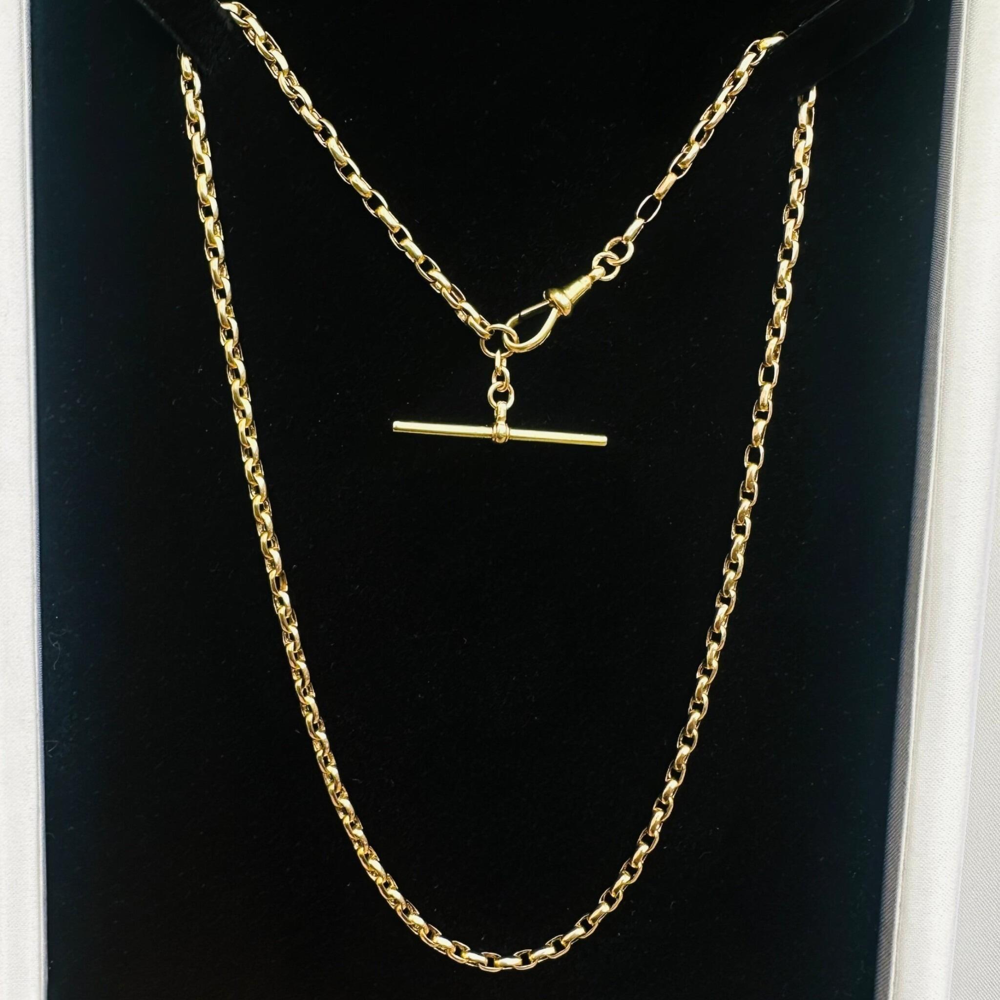 front view of Antique Victorian Gold Bike Link Chain, Dog Clip & T-bar Clasp displayed on black velvet