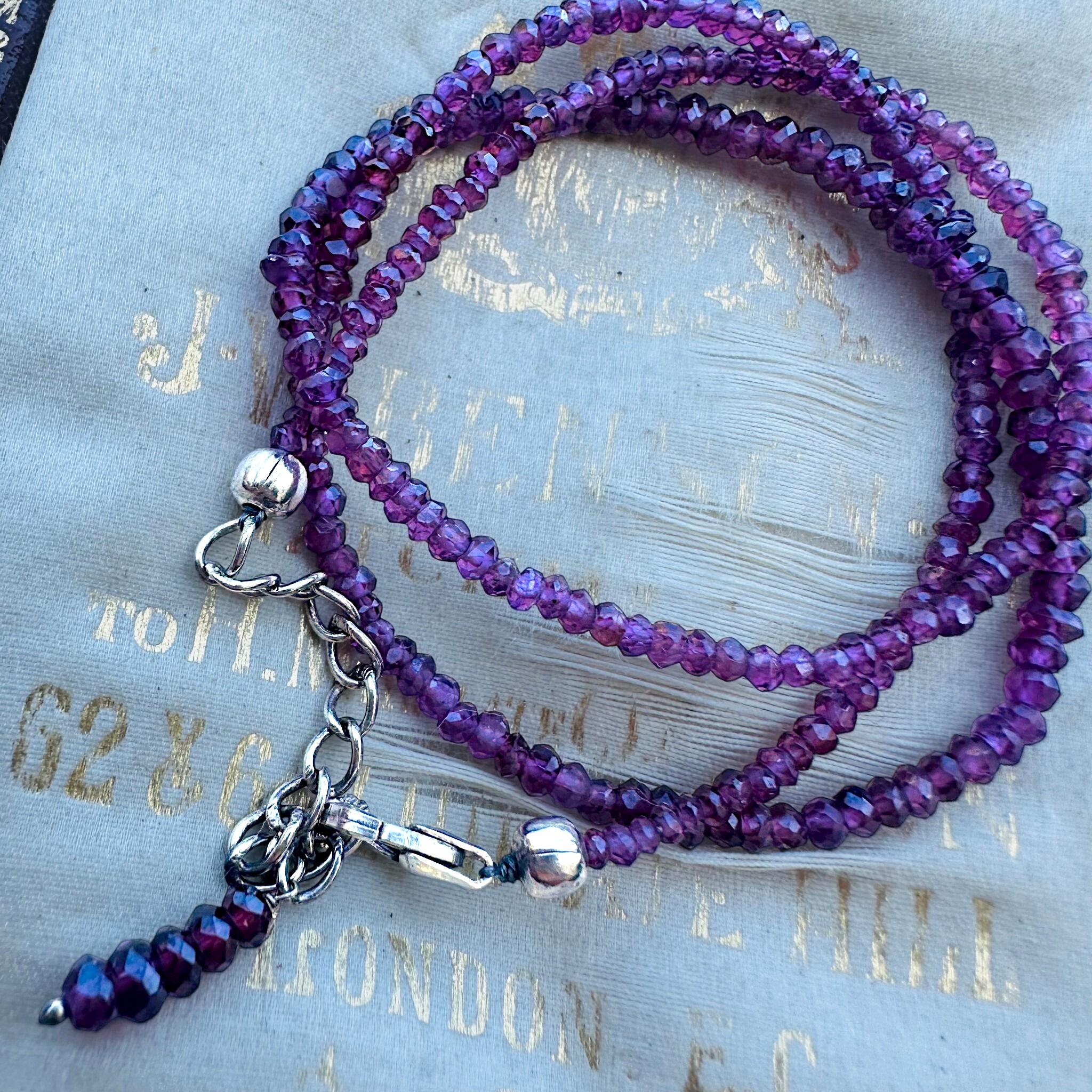 Silver & Amethyst Bead Necklace displayed on antique box