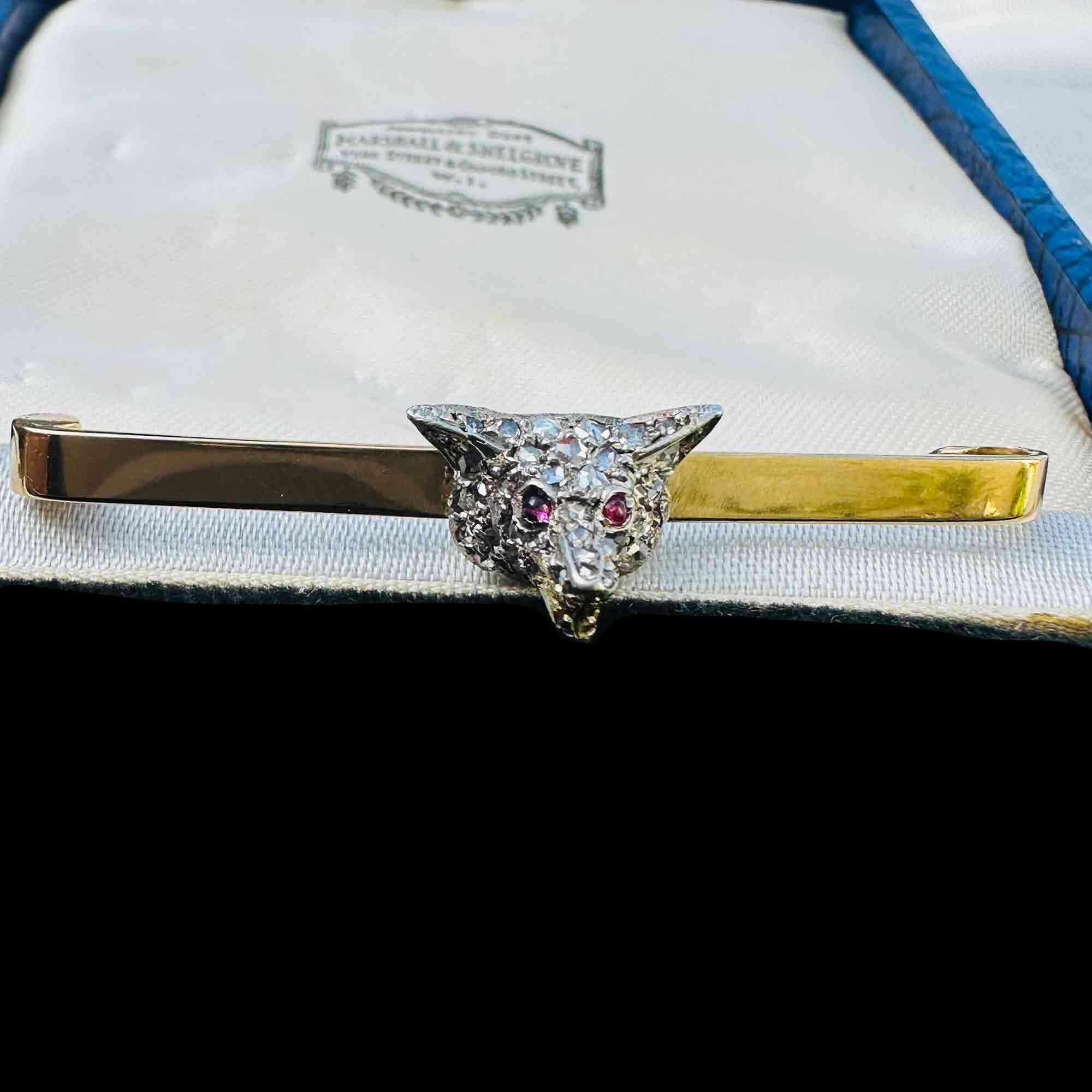 Antique diamond fox head brooch with rose cut diamonds, ruby eyes, and gold teeth detail