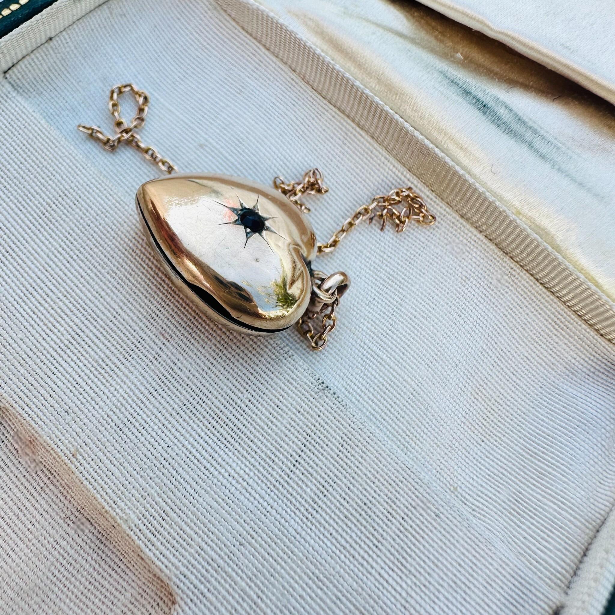 Victorian Gold Heart Locket Pendant with Garnet Star-Set Detail, side view in antique box,