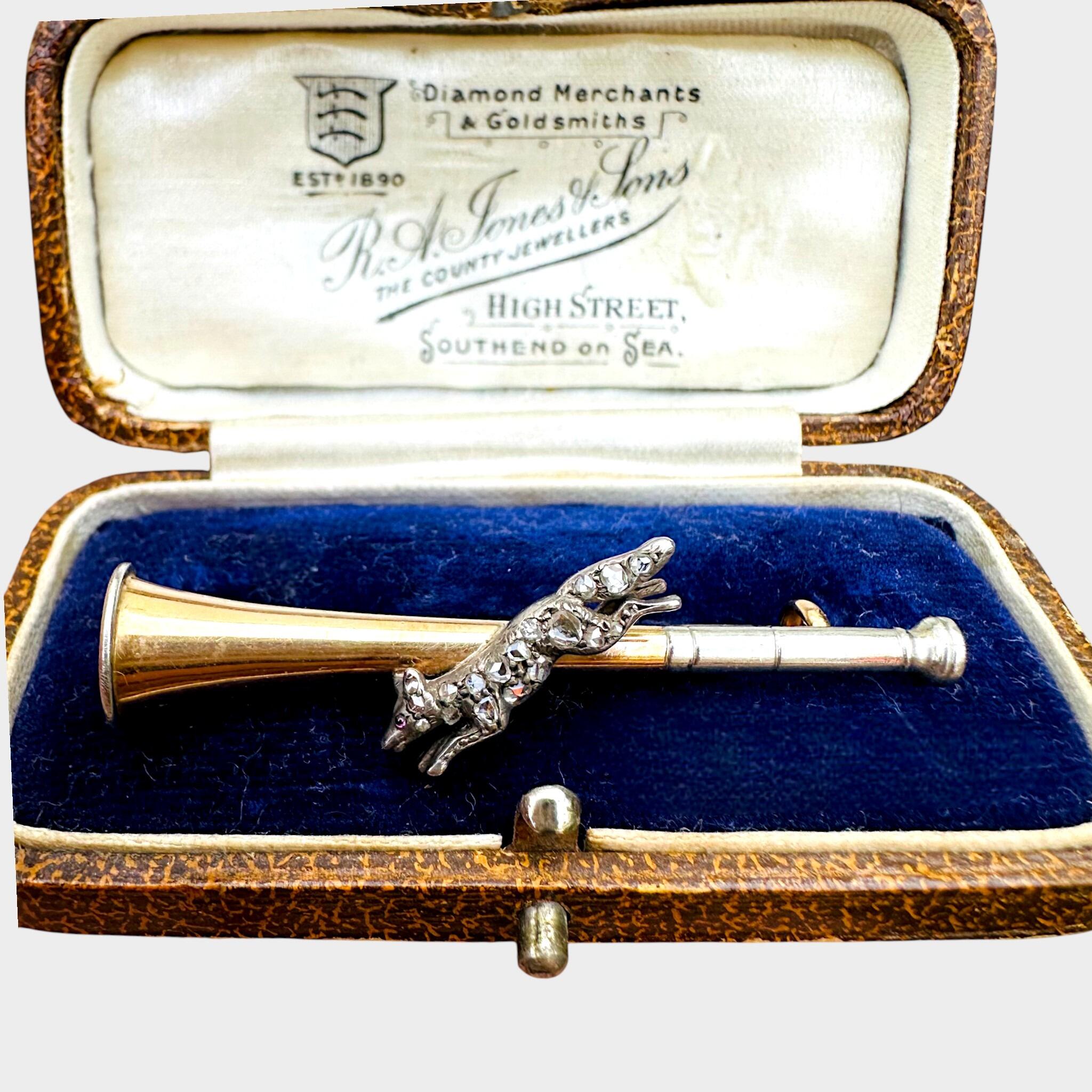15ct Gold & Platinum, Diamond Running Fox on Bugle Brooch, displayed in antique box