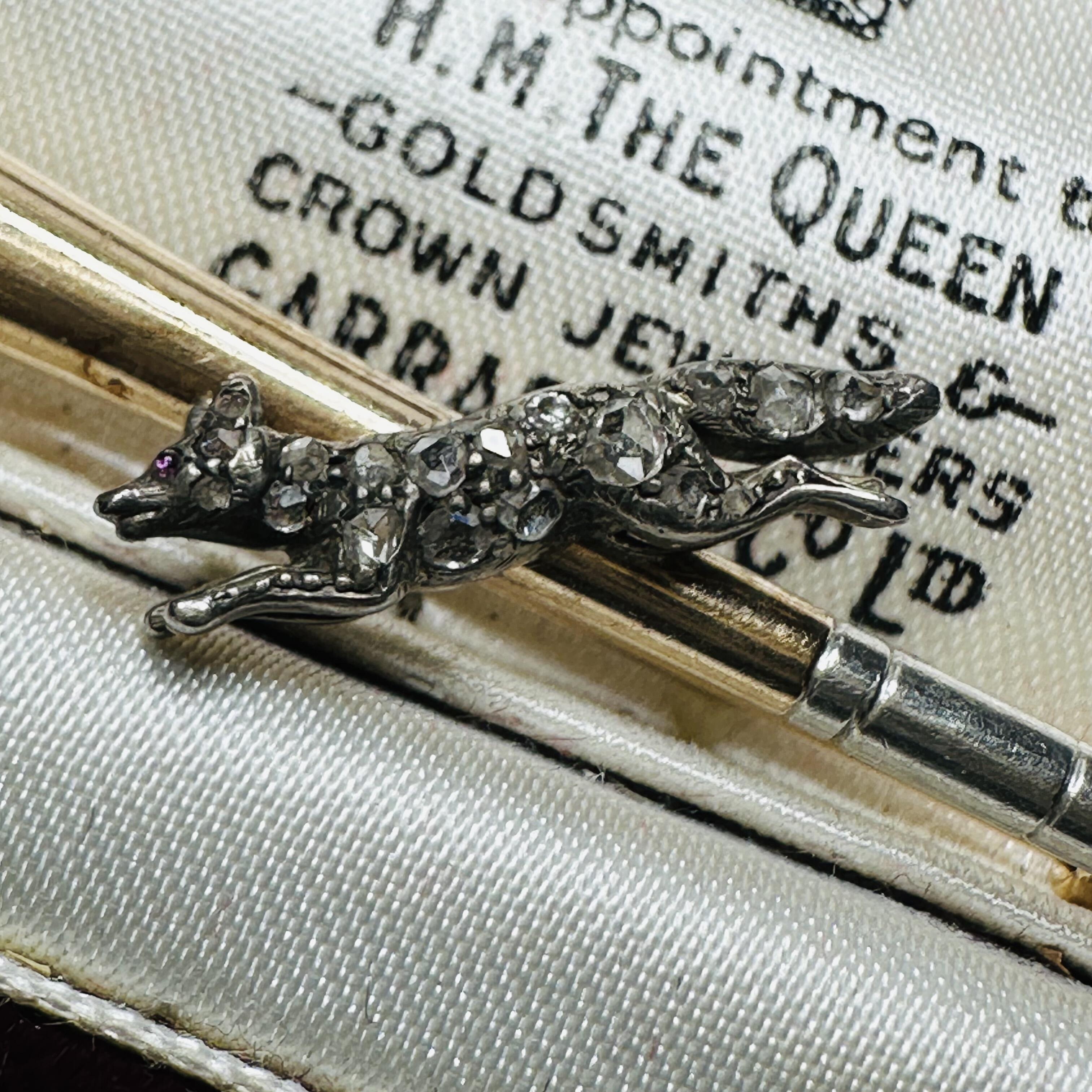 15ct Gold & Platinum, Diamond Running Fox on Bugle Brooch, displayed on antique box
