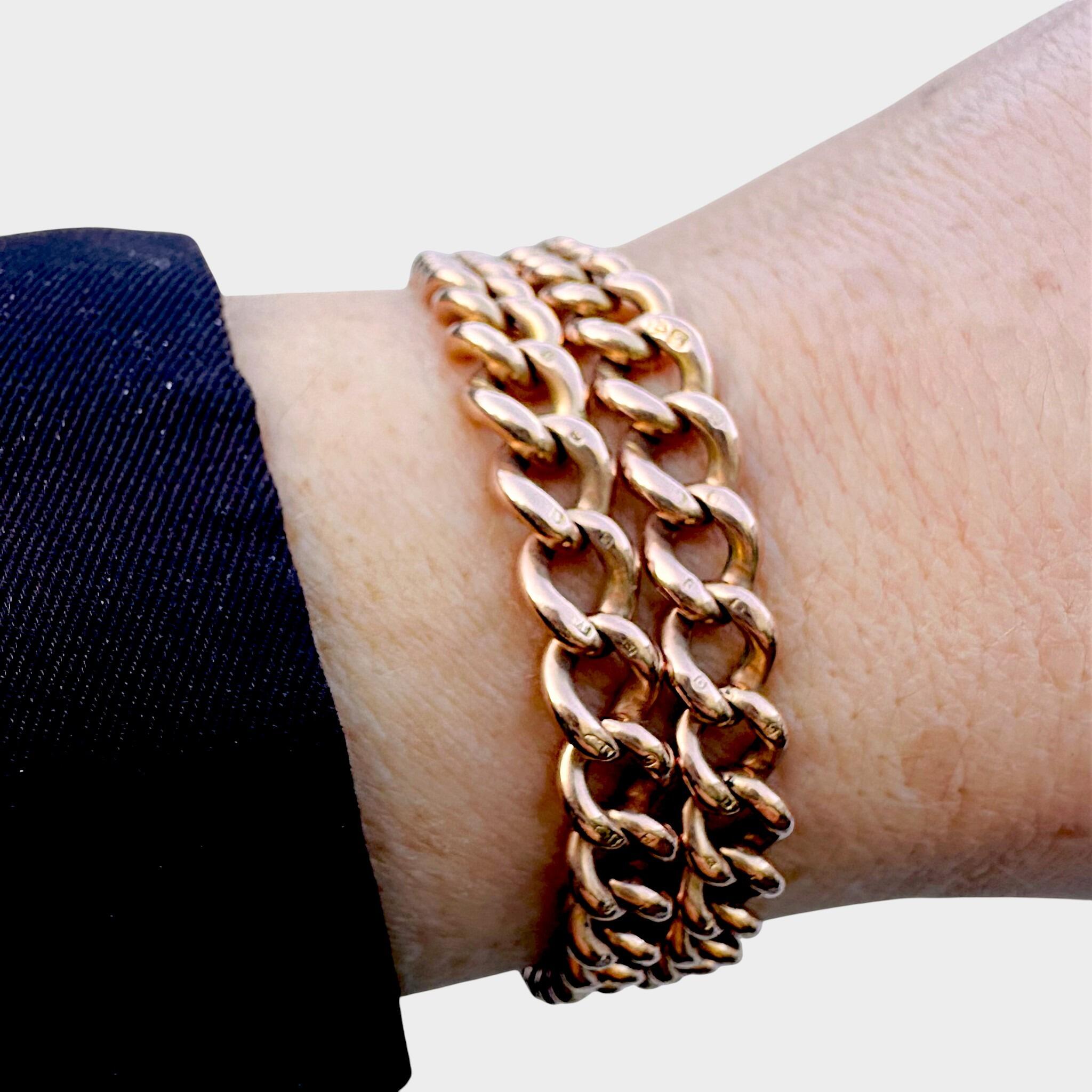 Rose Gold Double Curb Link Bracelet with Heart Padlock worn on models wrist