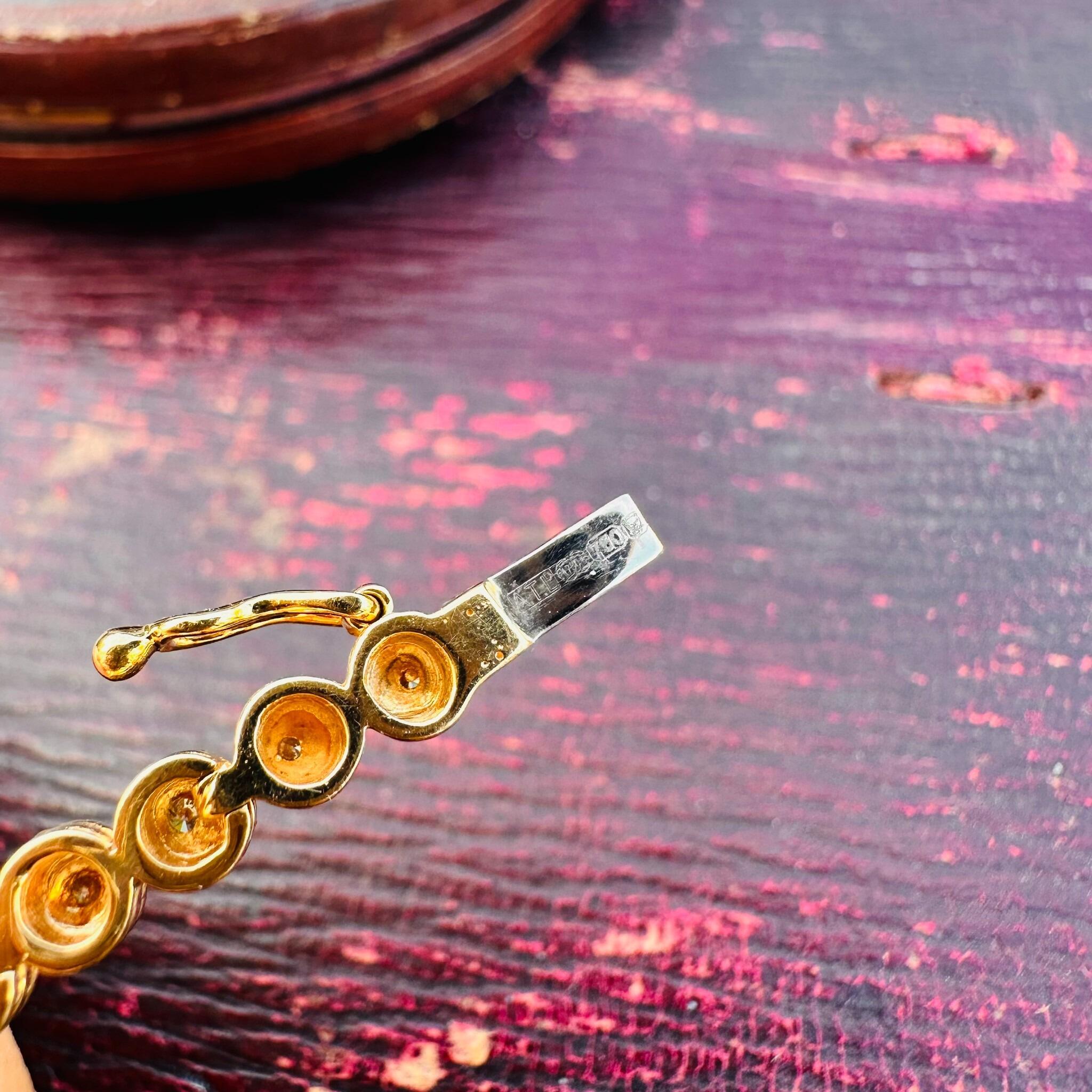 close up on clasp on 18ct Gold Diamond Line Tennis Bracelet, red textured box background